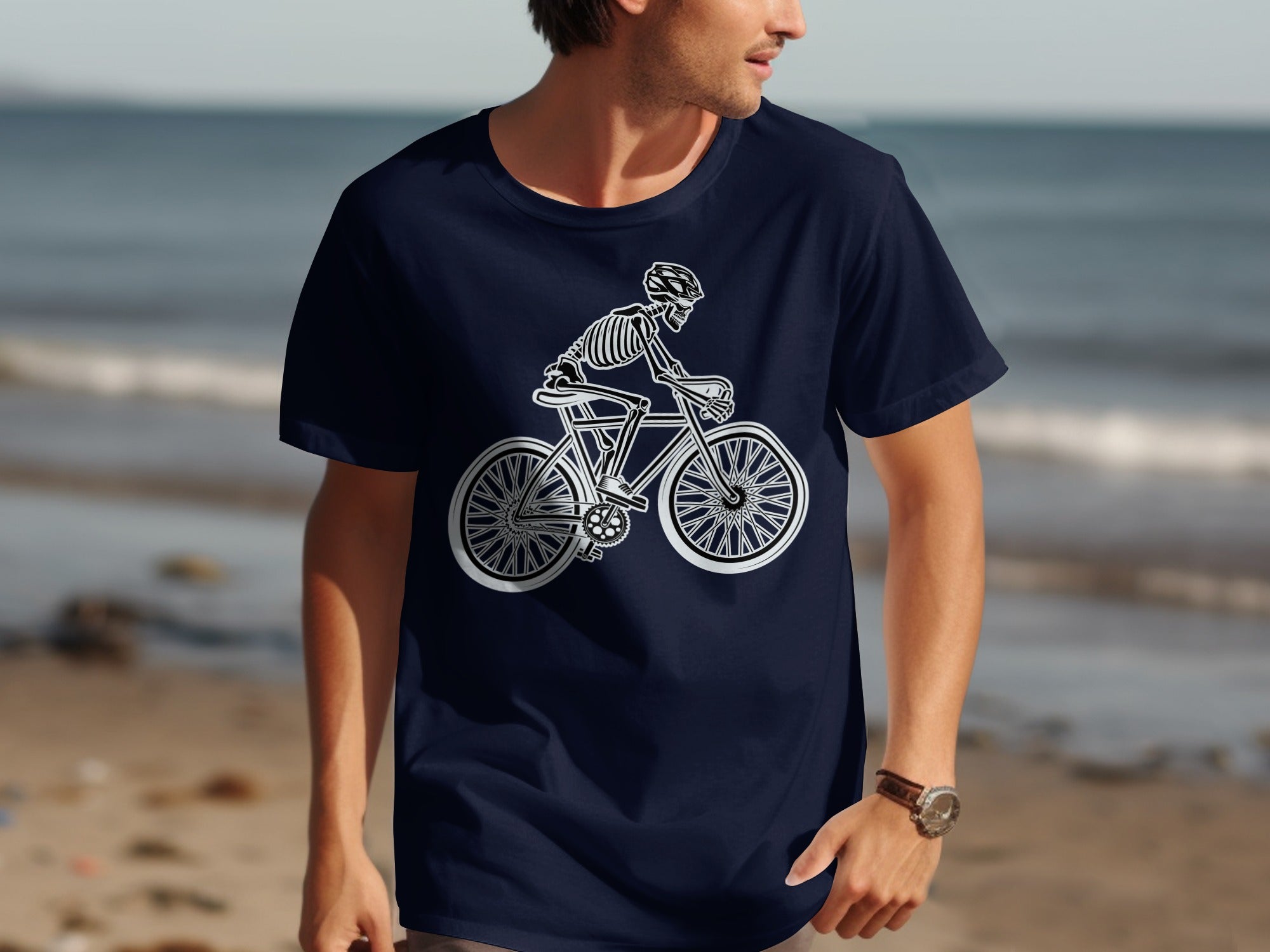 Navy t-shirt with a white line art skeleton riding a bicycle design.