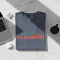 Navy t-shirt with "SHHHH... I'M READING" in retro font.