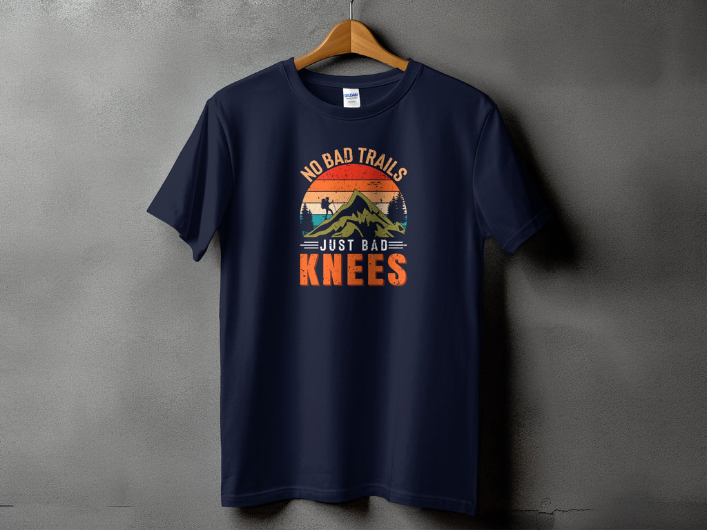 Navy t-shirt with graphic "No Bad Trails Just Bad Knees" and mountain silhouette.