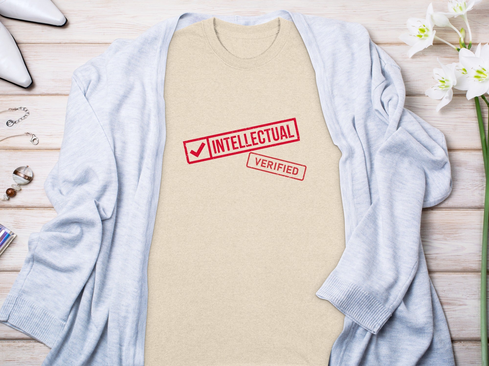 Light tan t-shirt with red "INTELLECTUAL VERIFIED" stamp on chest.