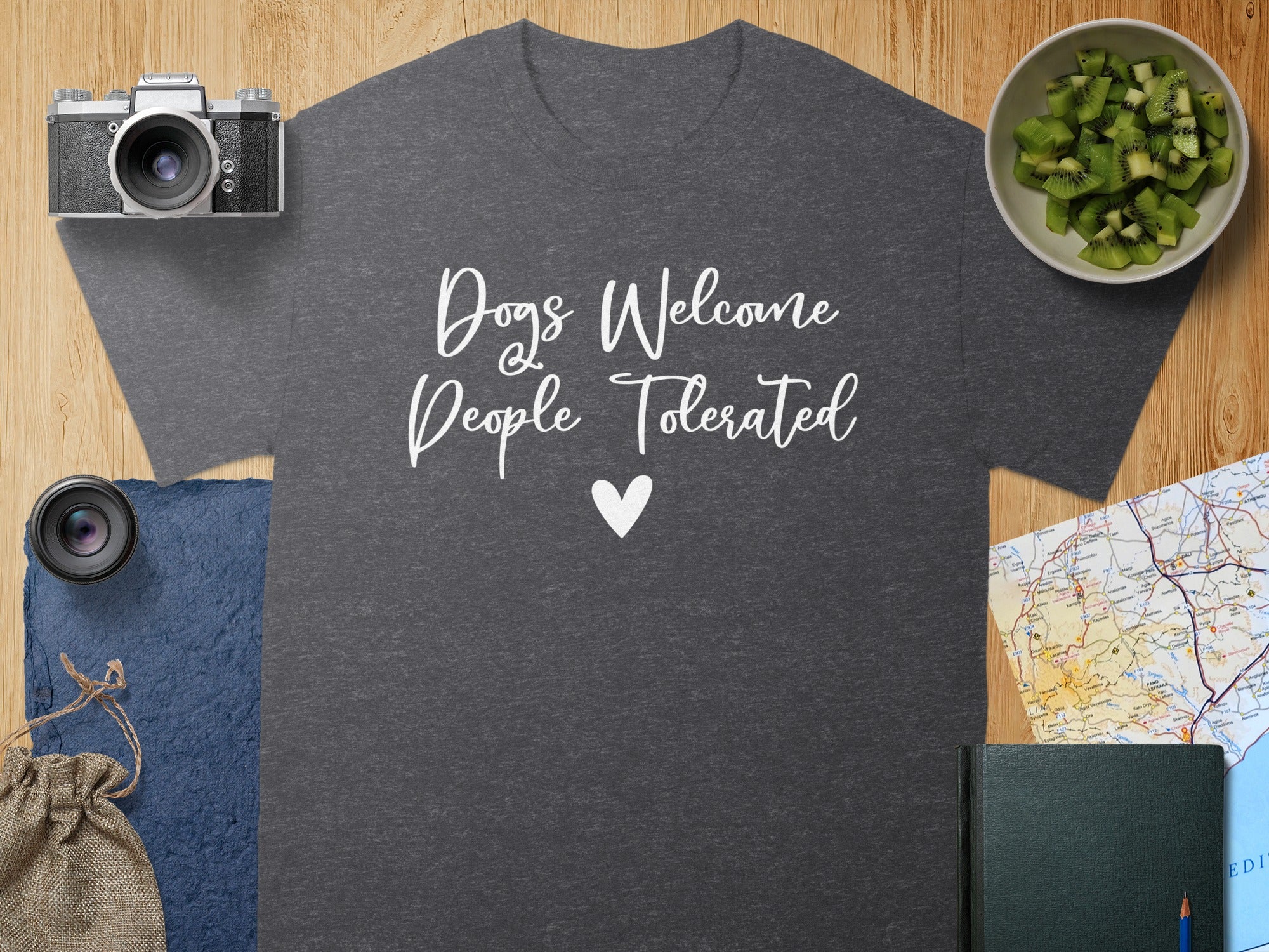 Dark grey t-shirt with white text "Dogs Welcome, People Tolerated" and a heart.