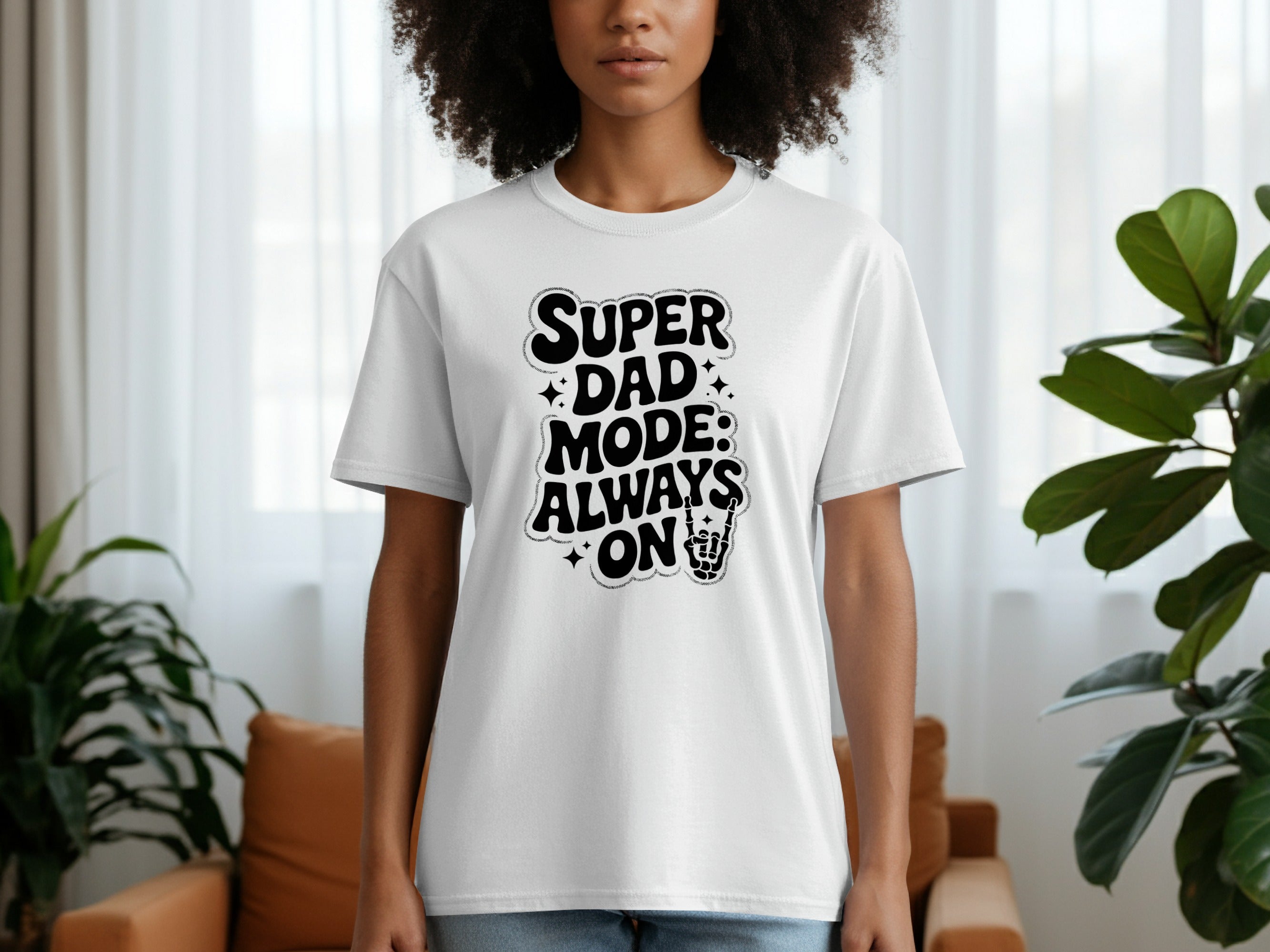 White t-shirt with black text "SUPER DAD MODE: ALWAYS ON" and rock on hand.