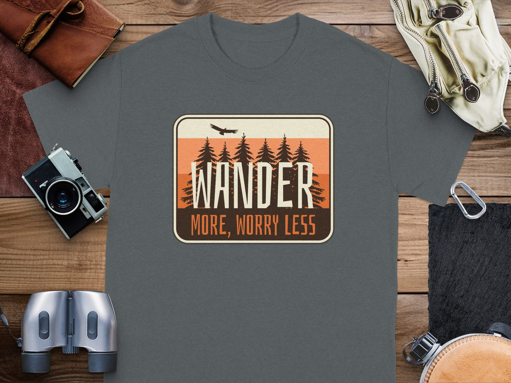 T-shirt with "WANDER MORE, WORRY LESS" text over trees and eagle graphic.