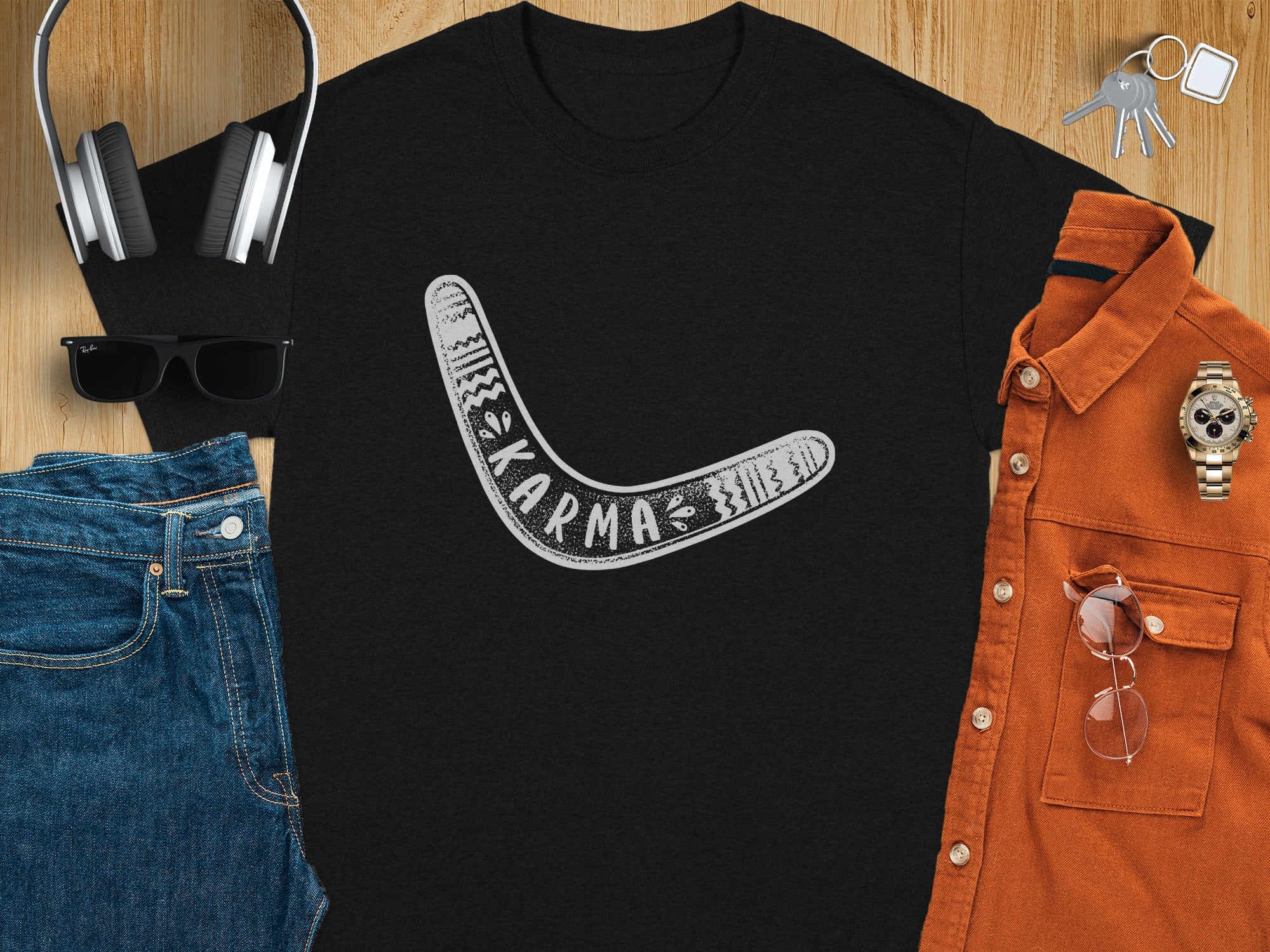 Black t-shirt with a white boomerang design and the word "KARMA" on it.
