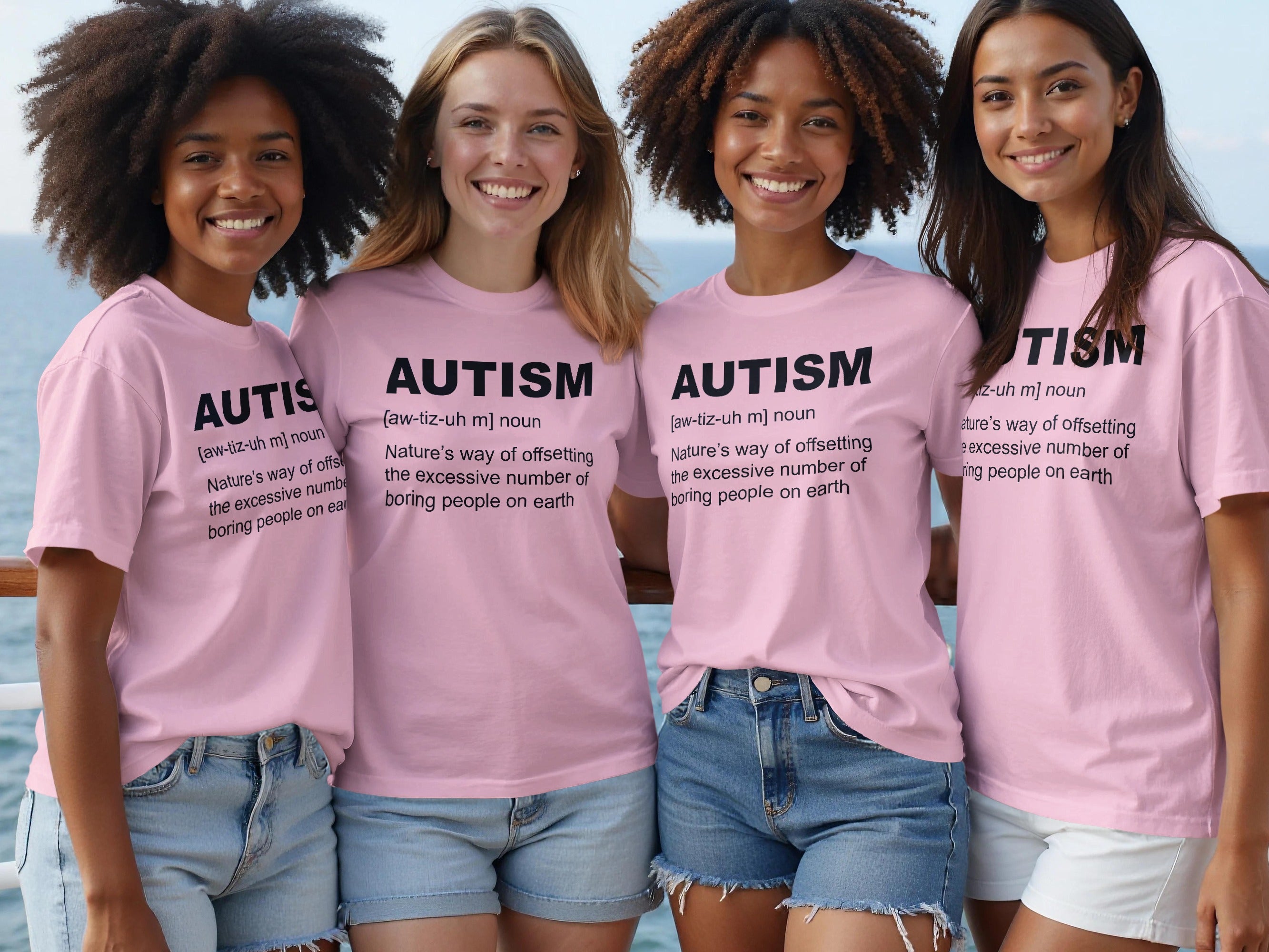 Four women in pink shirts with "AUTISM" definition text and denim shorts.
