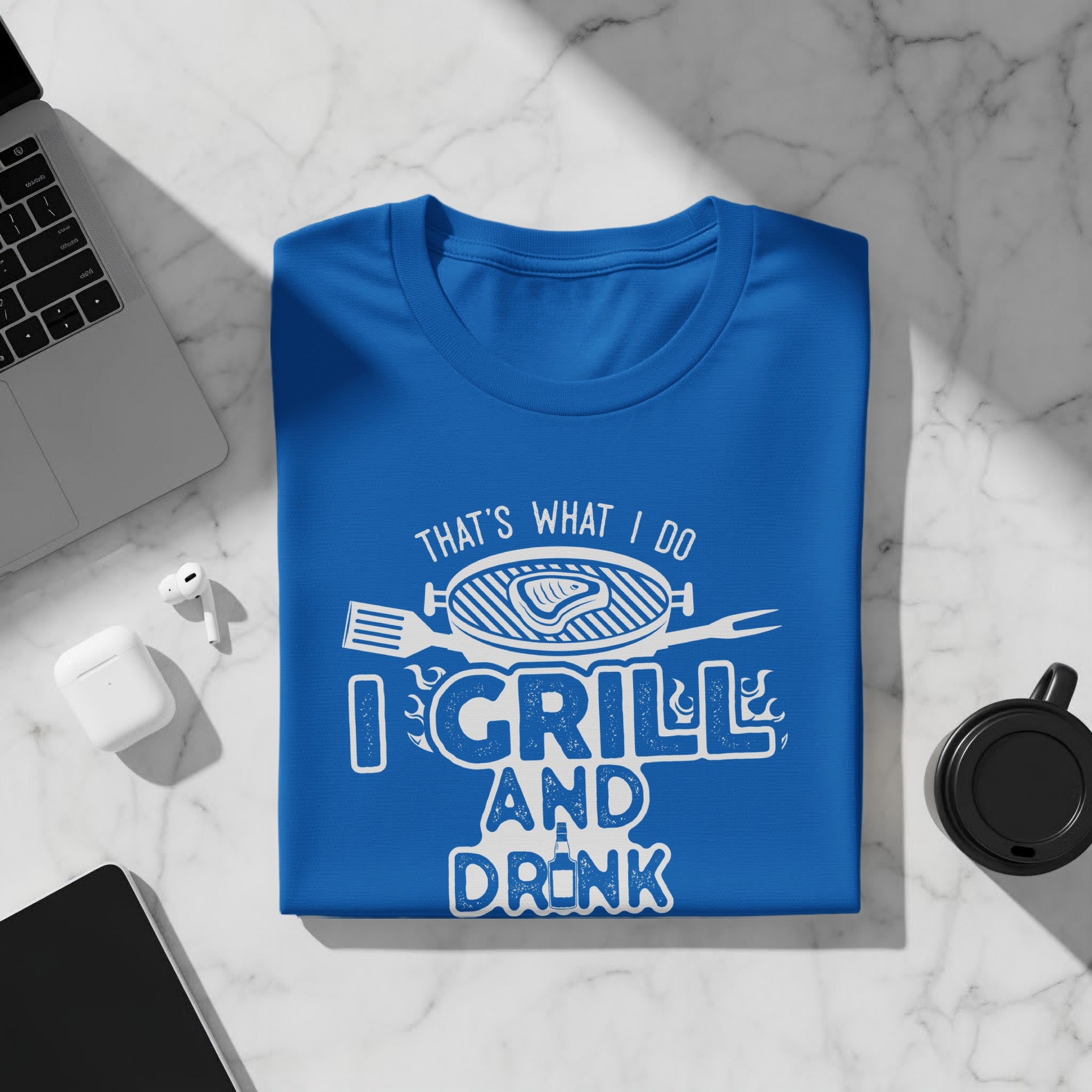Blue t-shirt with white text that reads "THAT'S WHAT I DO I GRILL AND DRINK".