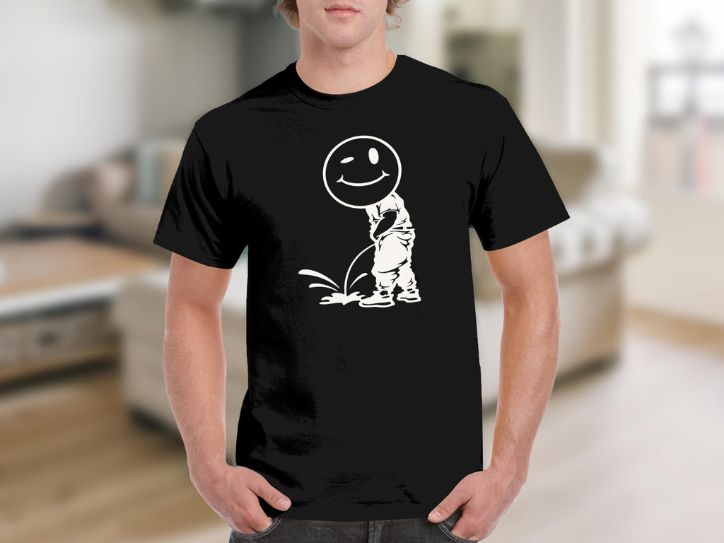 Black t-shirt with a white graphic of a winking smiley face over a urinating stick figure.