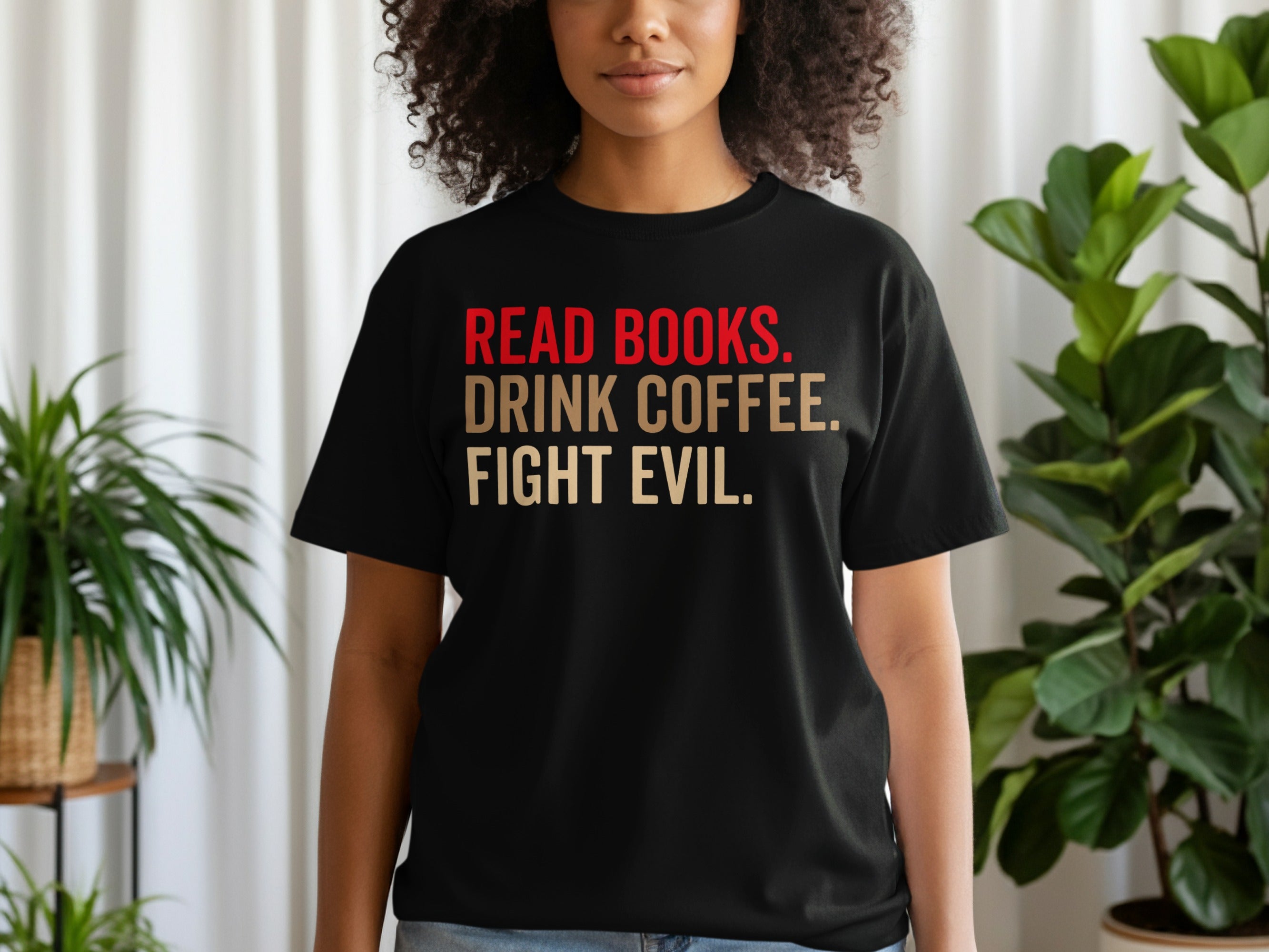 Black t-shirt with red and gold text reading "READ BOOKS. DRINK COFFEE. FIGHT EVIL."