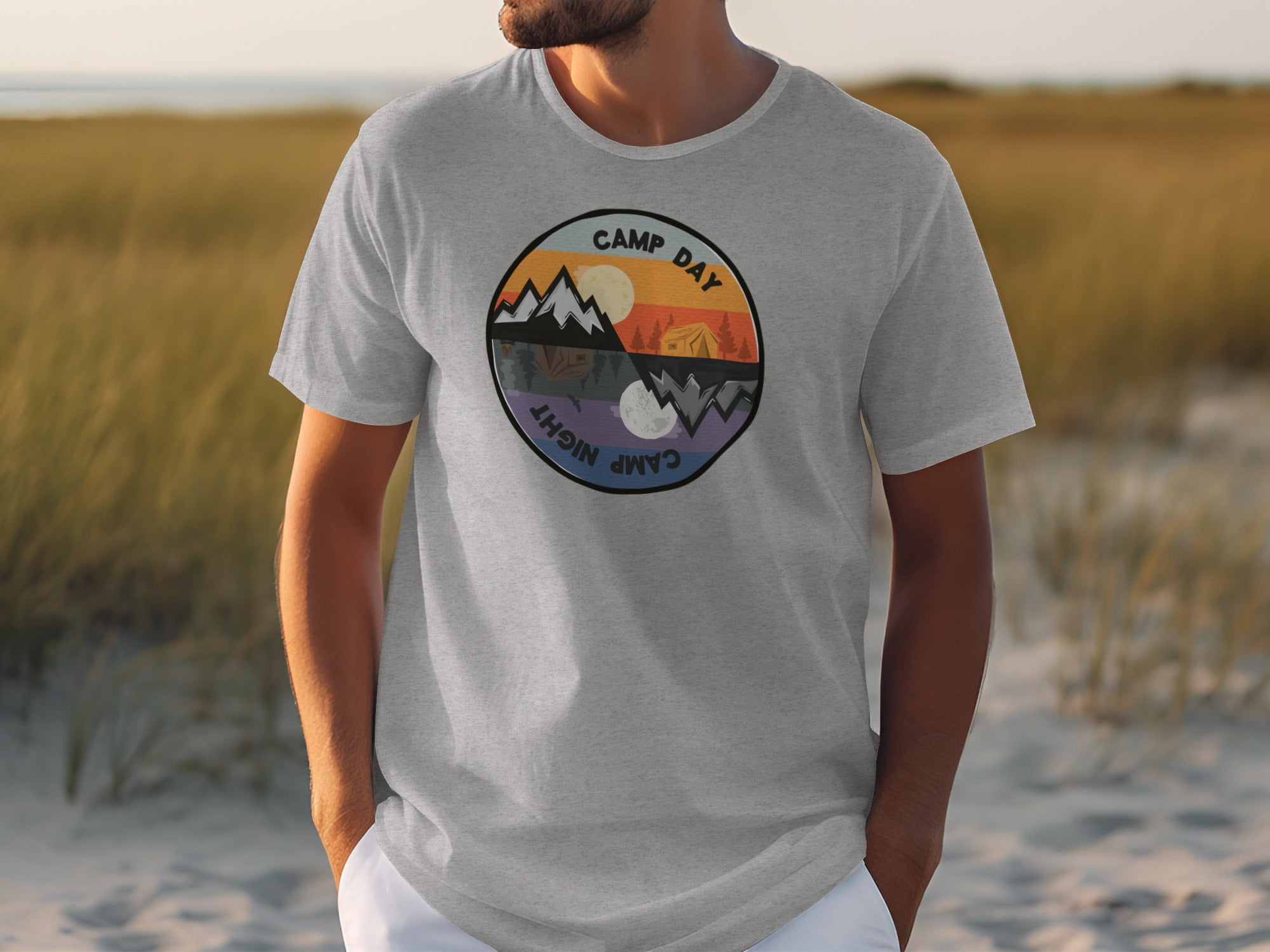 Grey t-shirt with circular "Camp Day Night" graphic showing day and night camping scenes.