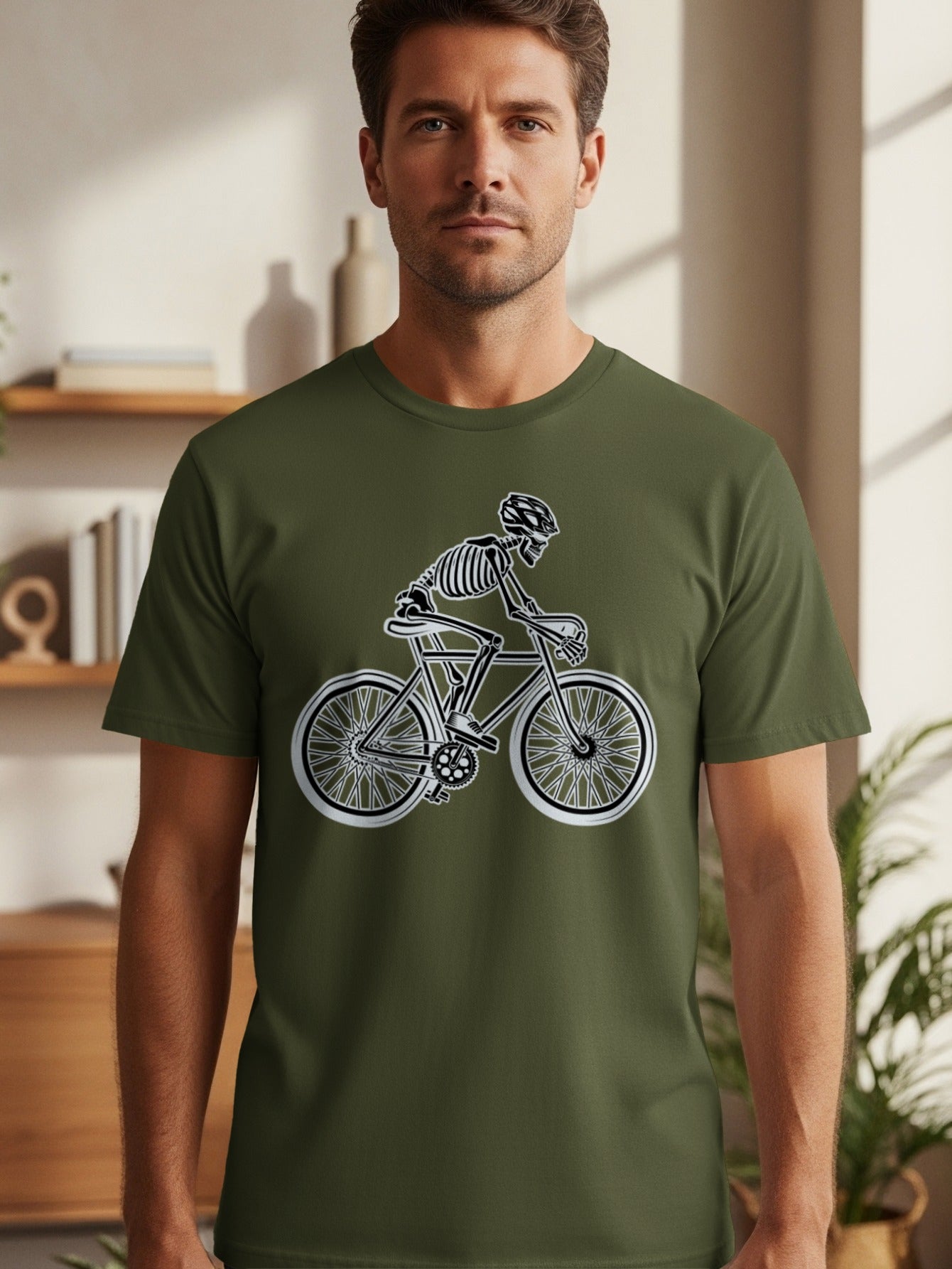 Skeleton on bicycle graphic on a green t-shirt.