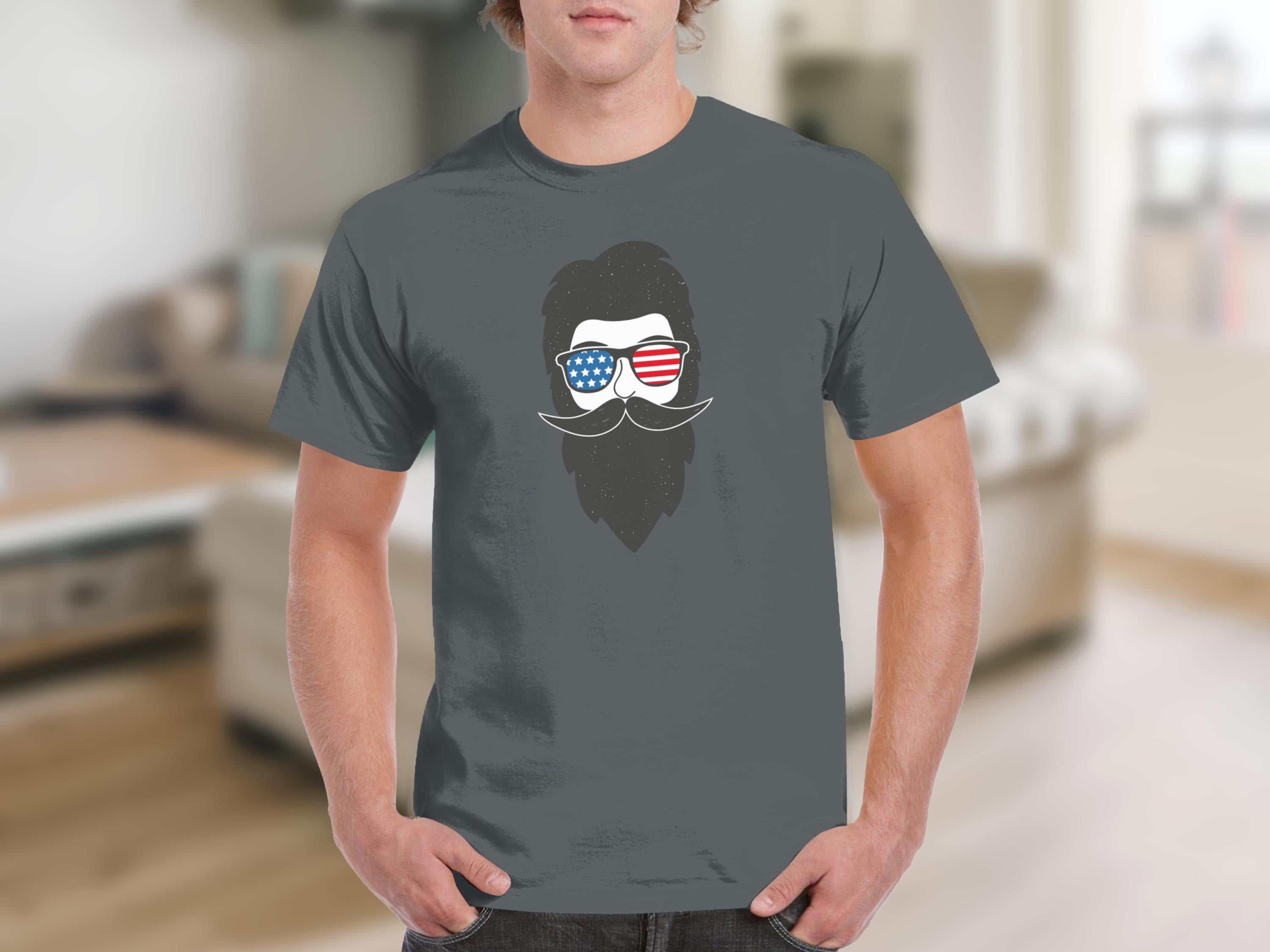 Gray t-shirt with a graphic of a bearded man wearing American flag sunglasses.