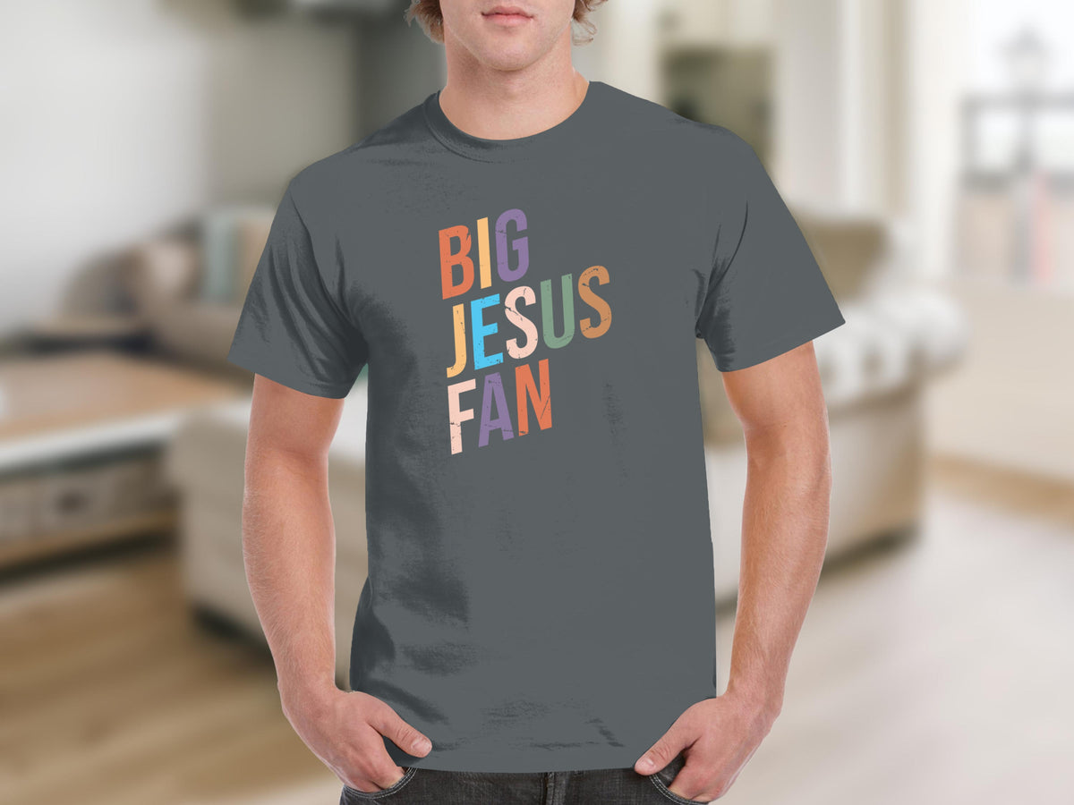 "Big Jesus Fan" text on a gray t-shirt worn by a person.
