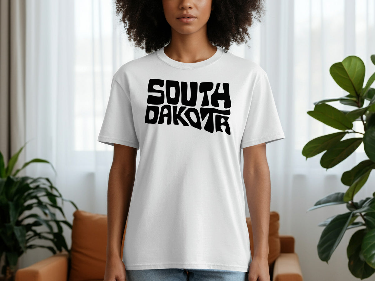 White t-shirt with black "SOUTH DAKOTA" text in a bold, wavy font.