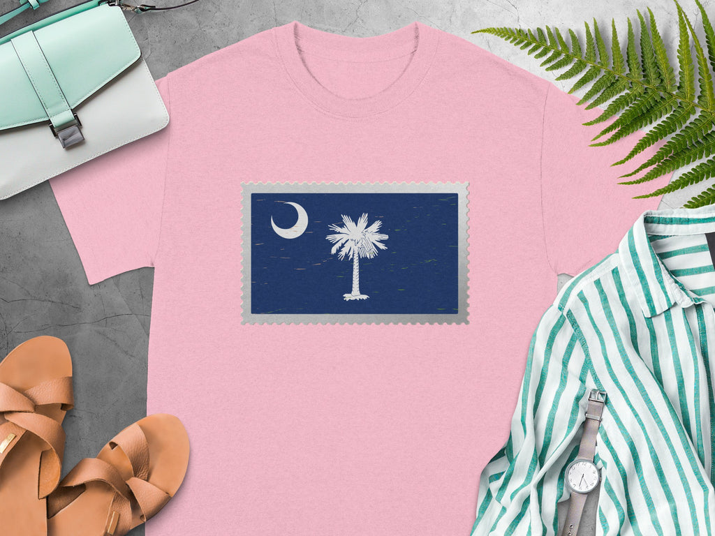 Pink t-shirt with a stamp graphic of the South Carolina flag.