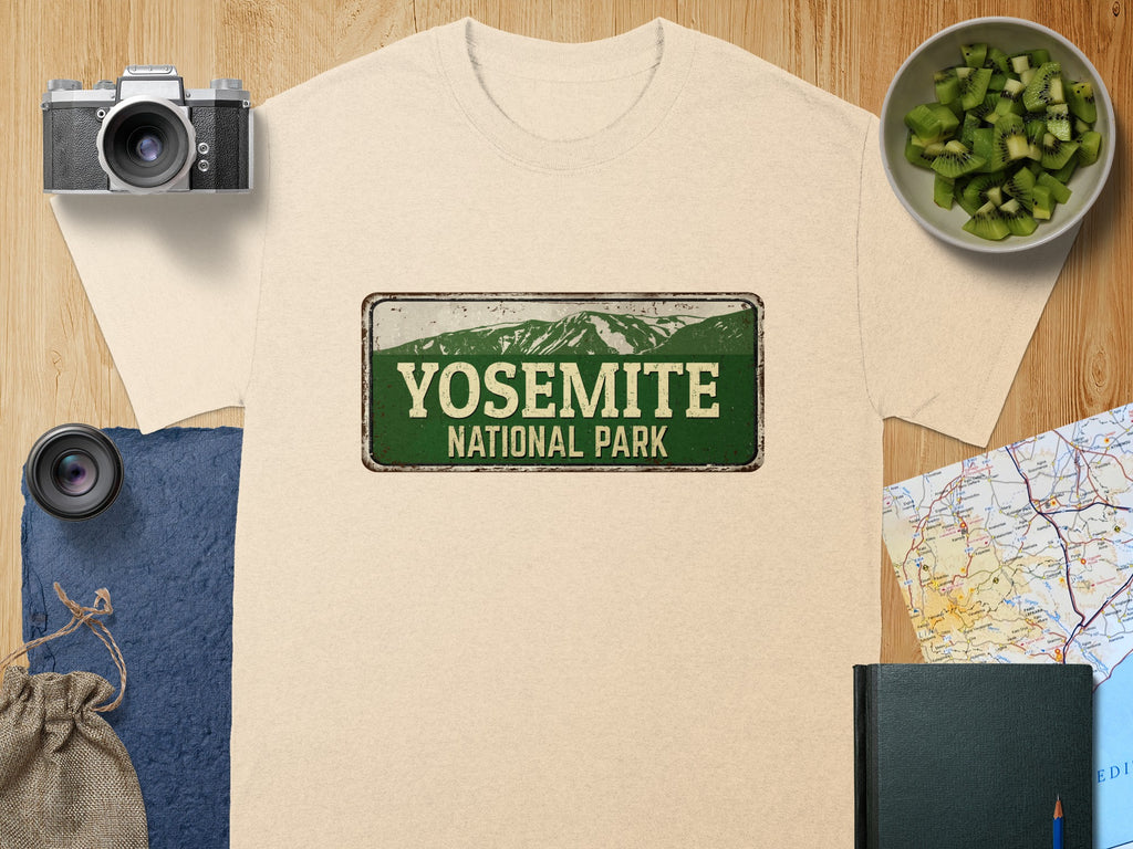 Light beige t-shirt featuring a distressed Yosemite National Park sign graphic.