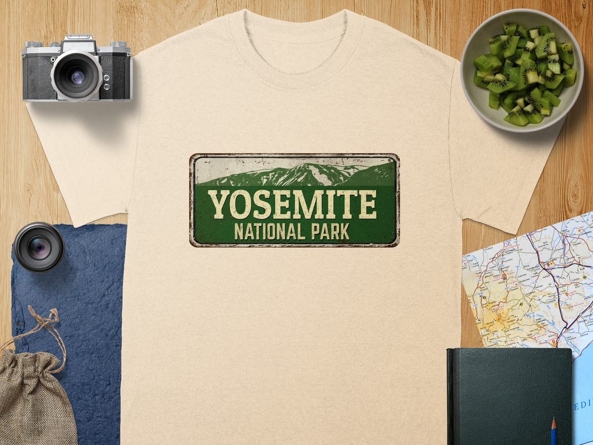 Light beige t-shirt featuring a distressed Yosemite National Park sign graphic.