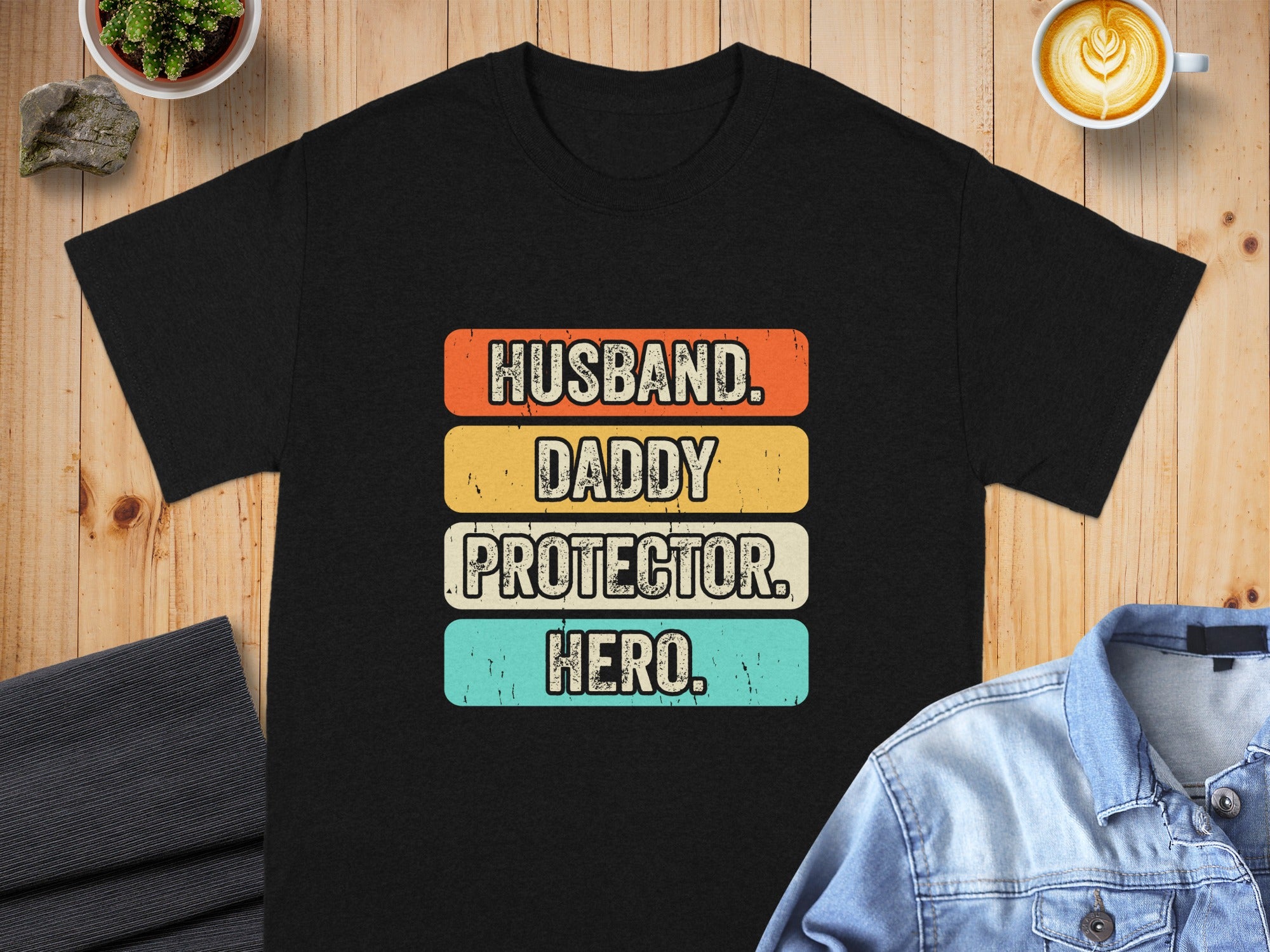 Black t-shirt with text "Husband. Daddy. Protector. Hero."