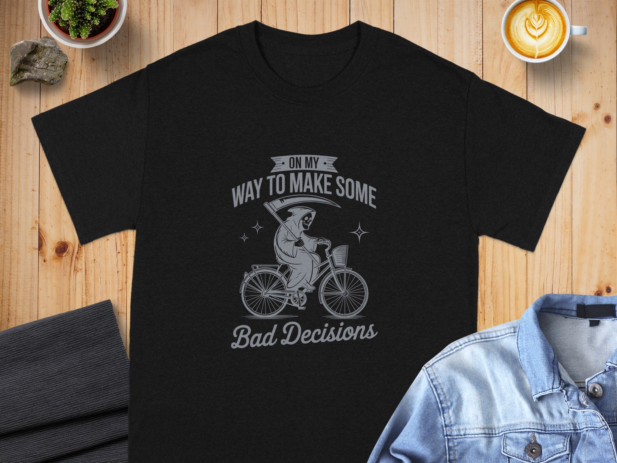 Black t-shirt with grim reaper on bicycle graphic and text \"On My Way To Make Some Bad Decisions\".