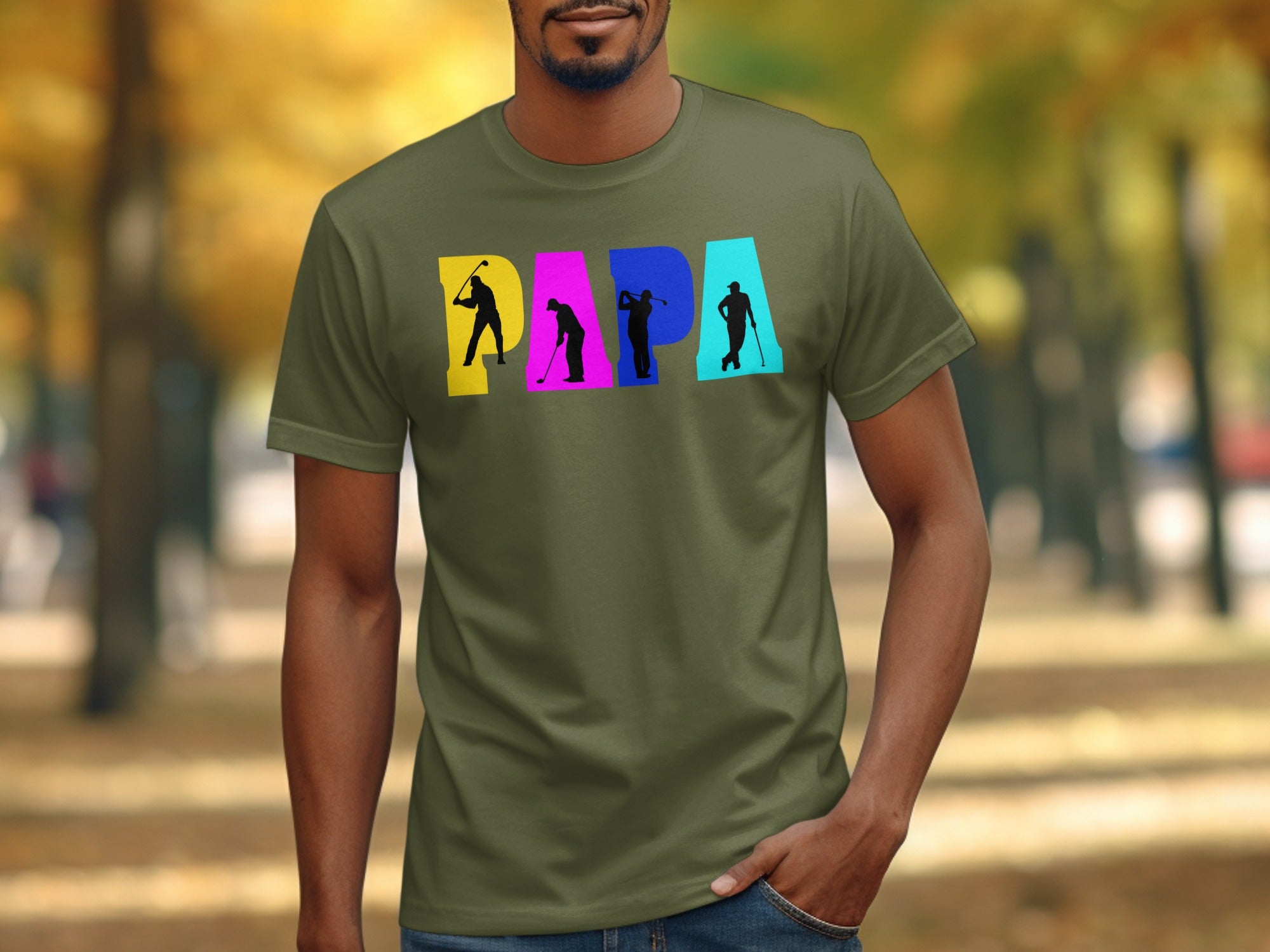Olive shirt with "PAPA" text featuring golfer silhouettes in colorful blocks.