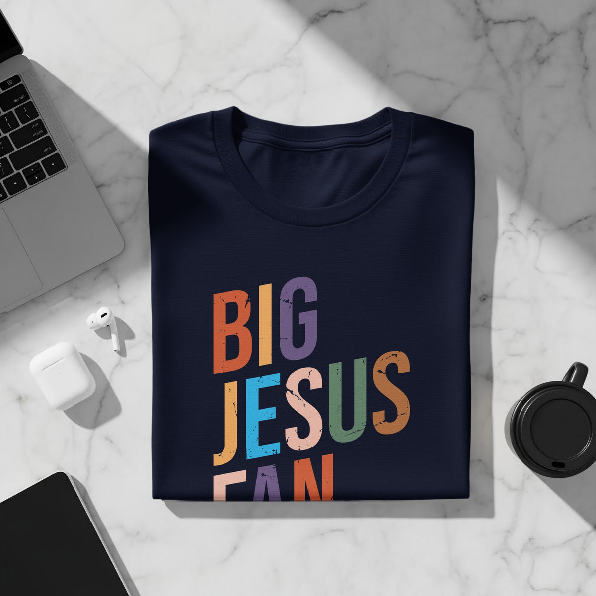 Navy t-shirt with distressed multicolored text reading "BIG JESUS FAN".