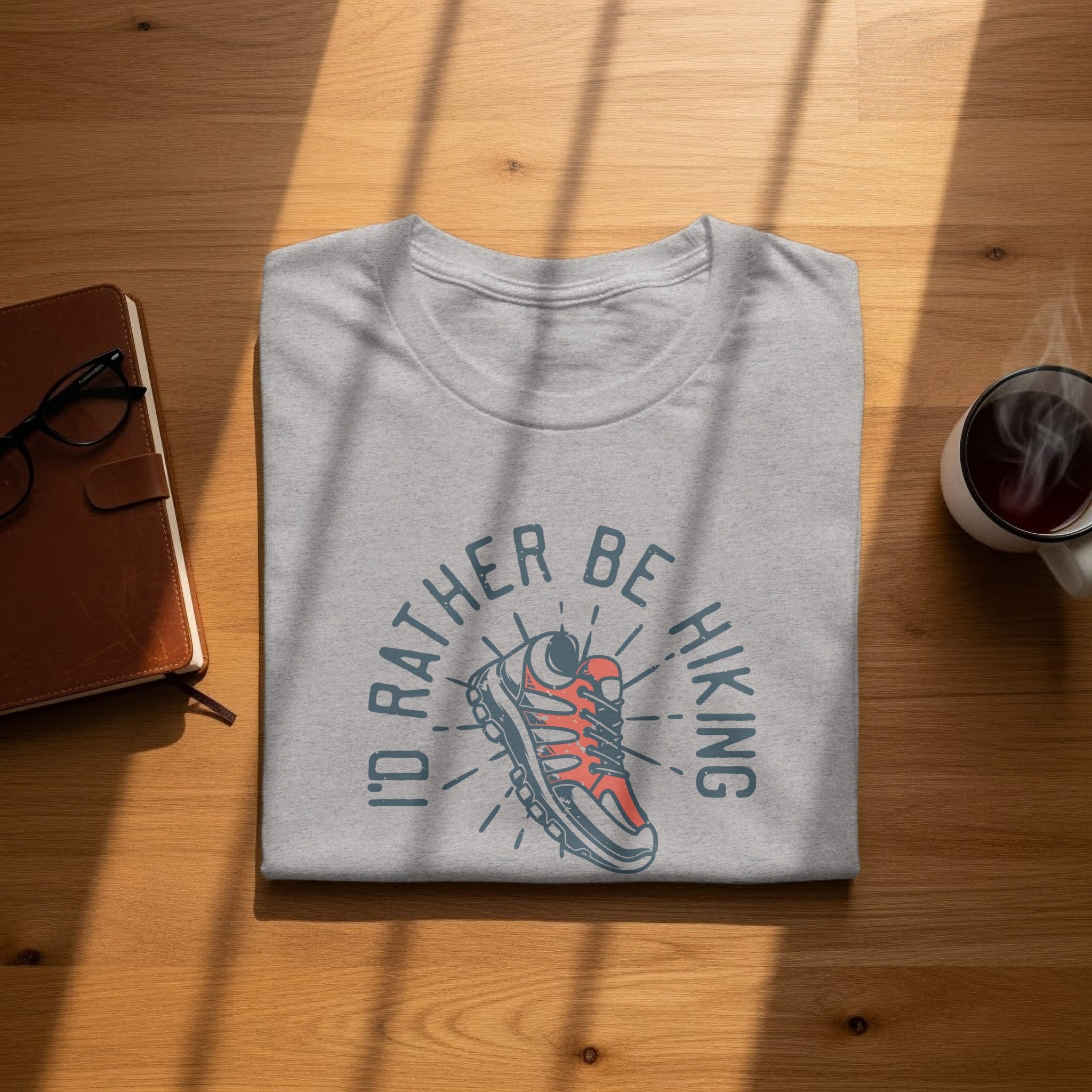 Gray t-shirt with "I'd rather be hiking" and a hiking boot graphic.