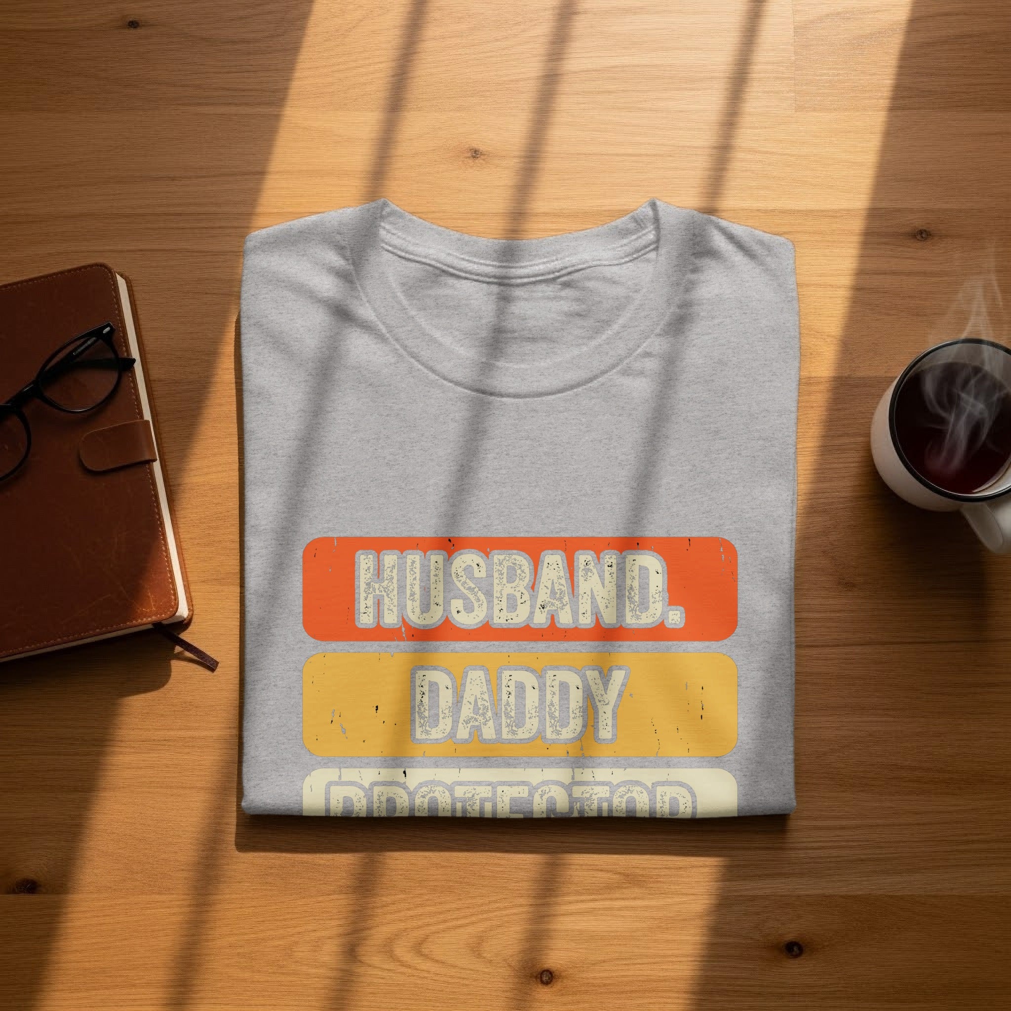 Gray t-shirt with text "Husband, Daddy, Protector" on the front.