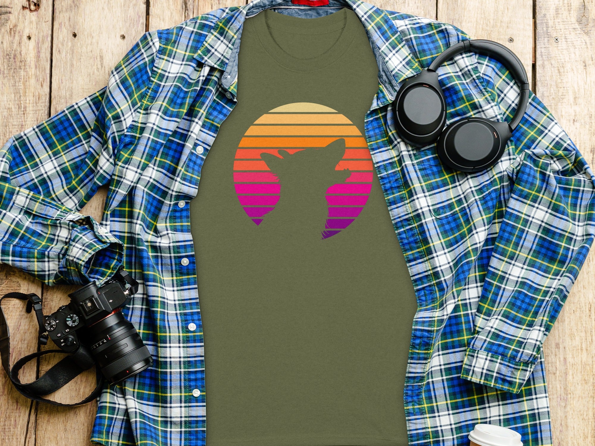 Olive green t-shirt with a fox silhouette and striped sunset graphic.