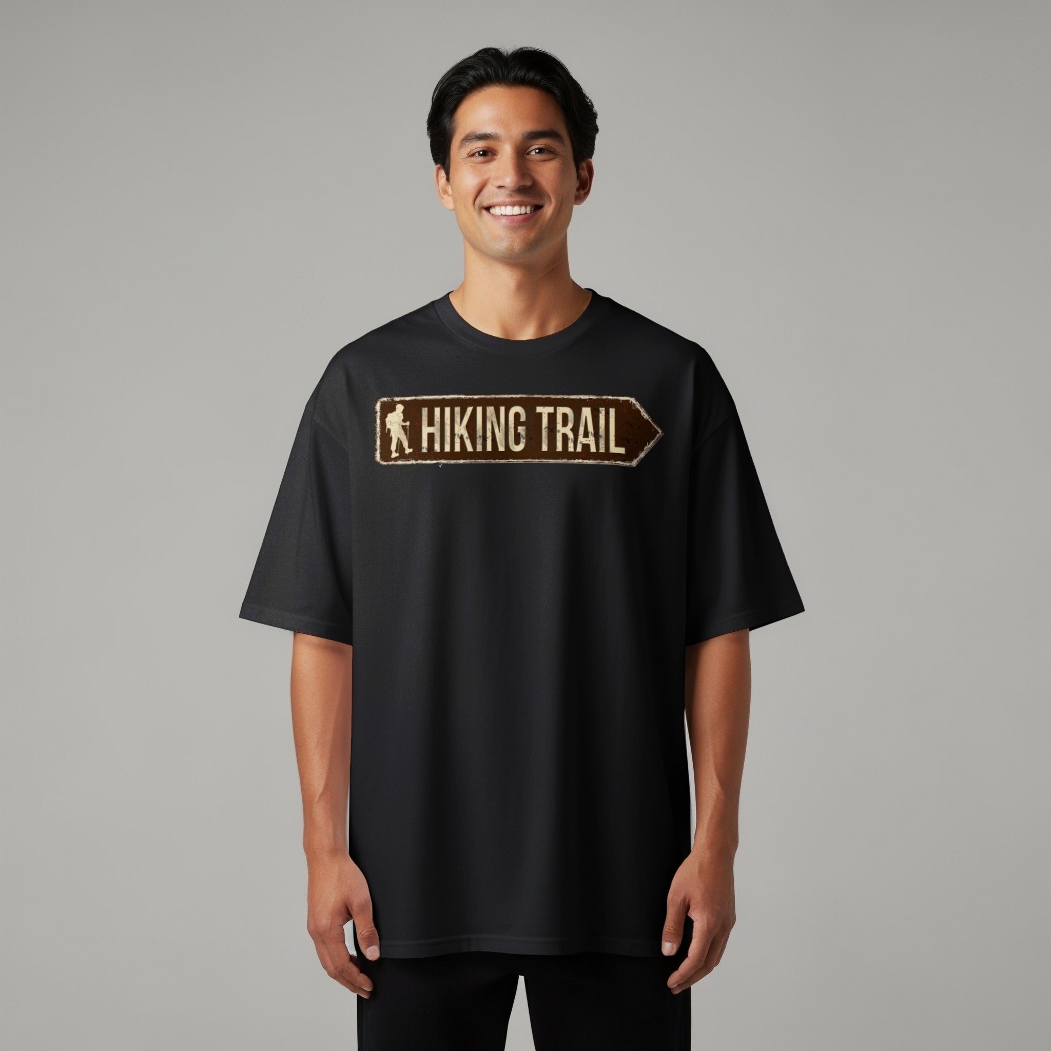 Black t-shirt with a distressed "Hiking Trail" sign graphic pointing right.