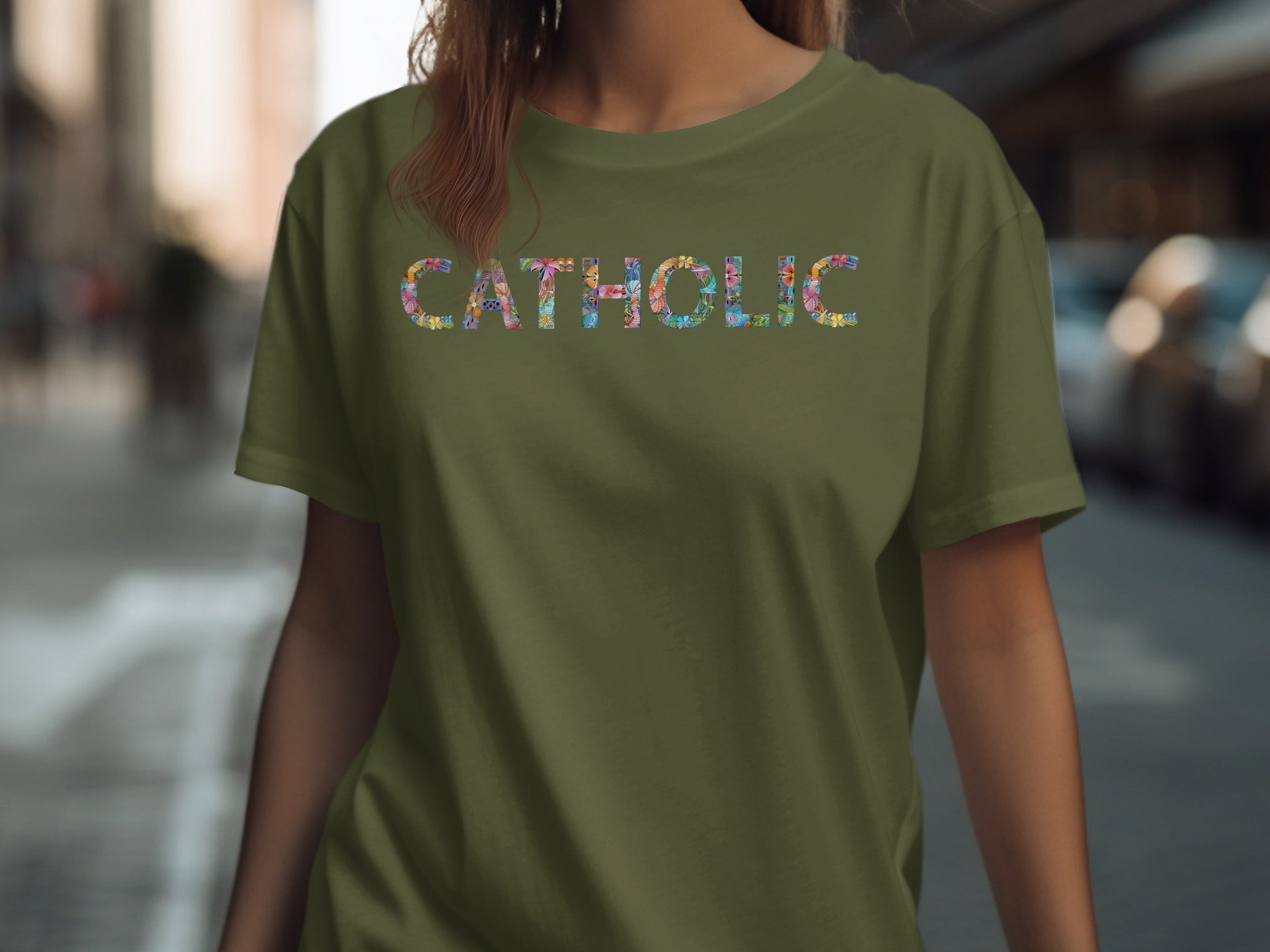 Olive green t-shirt with colorful floral "CATHOLIC" text design.