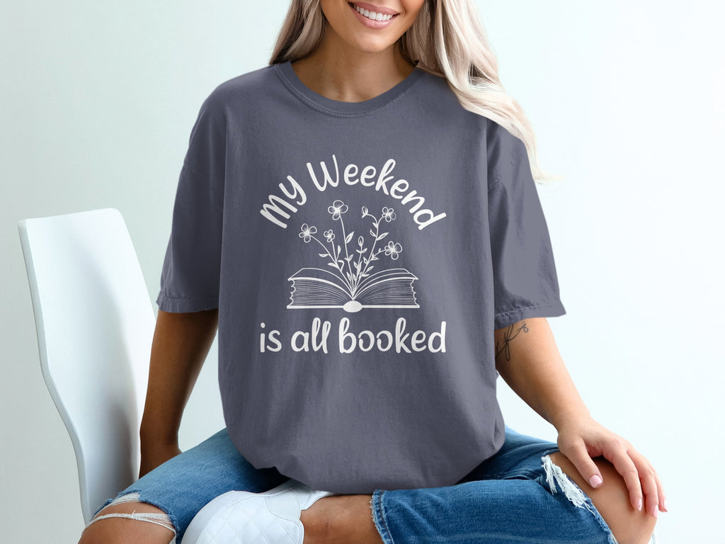 Gray t-shirt with white text and floral book design: "my Weekend is all booked".
