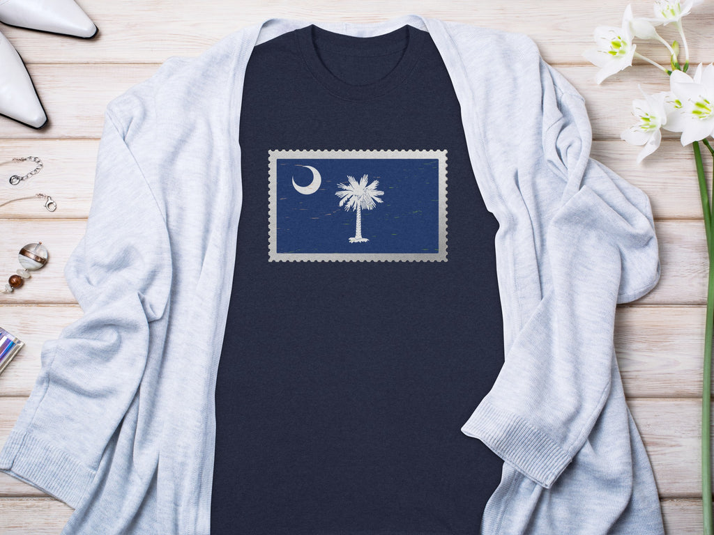 Navy t-shirt with a postage stamp graphic of the South Carolina flag.