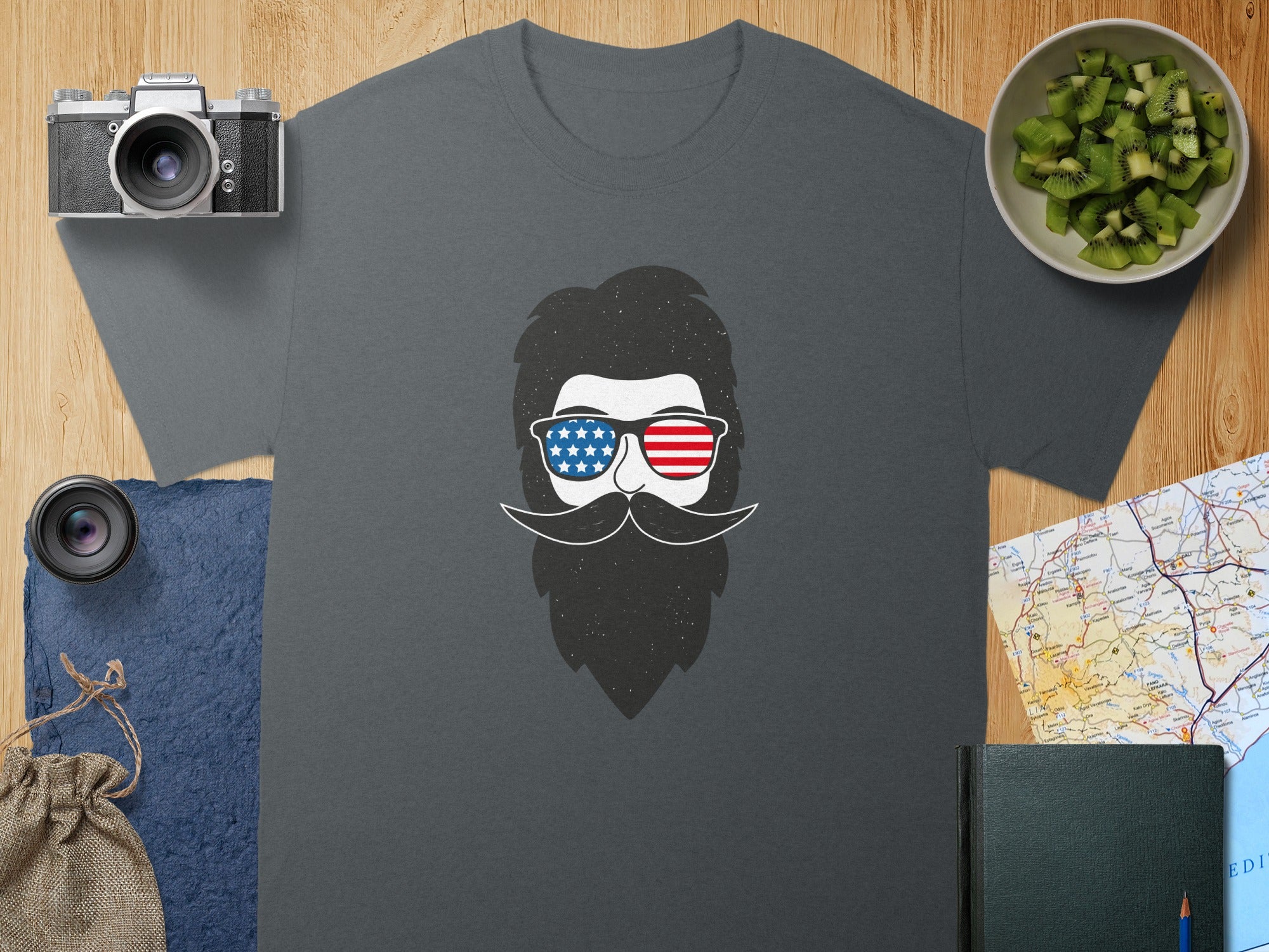 Gray t-shirt with a graphic of a beard, mustache, and sunglasses with an American flag pattern.