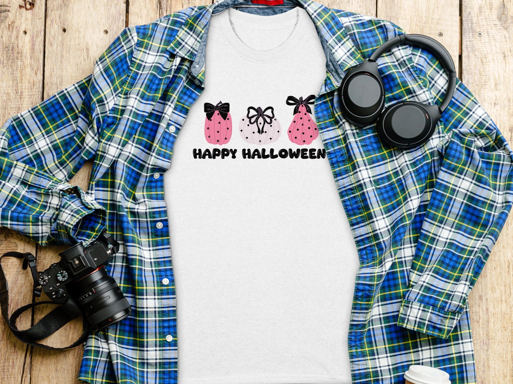White t-shirt with pink pumpkins and "Happy Halloween" text.