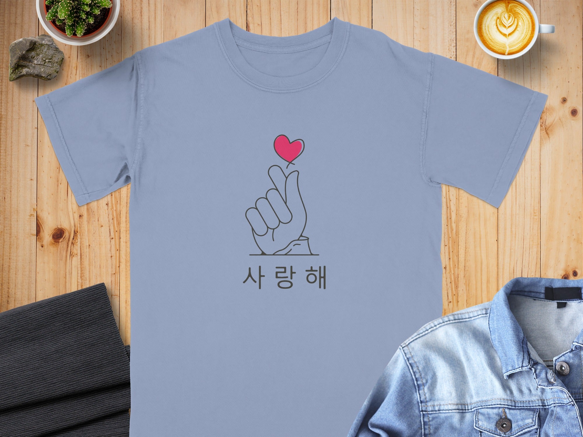 Light blue t-shirt with finger heart symbol and Korean text "사랑해"
