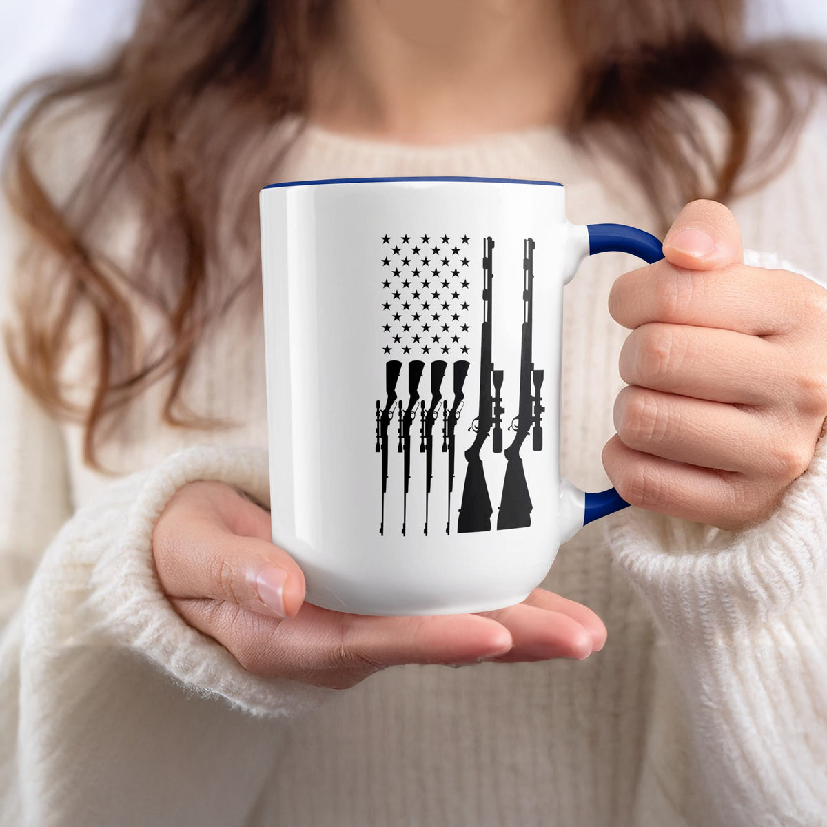 White mug with blue handle featuring black rifle silhouettes forming an American flag design.