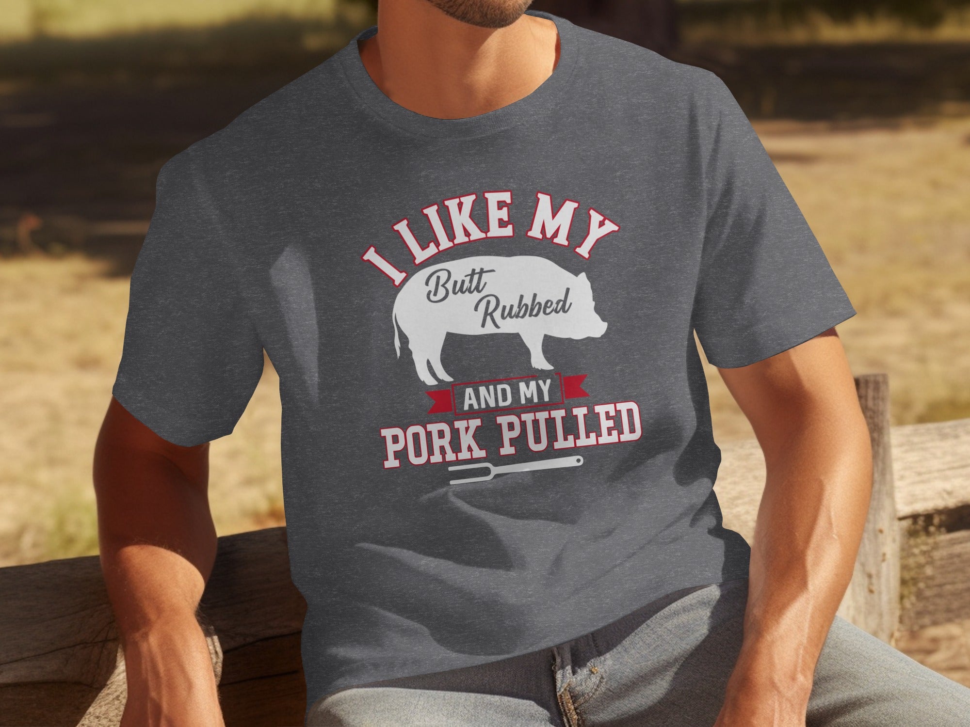 Dark grey t-shirt with text "I LIKE MY Butt Rubbed AND MY PORK PULLED" and a pig graphic.
