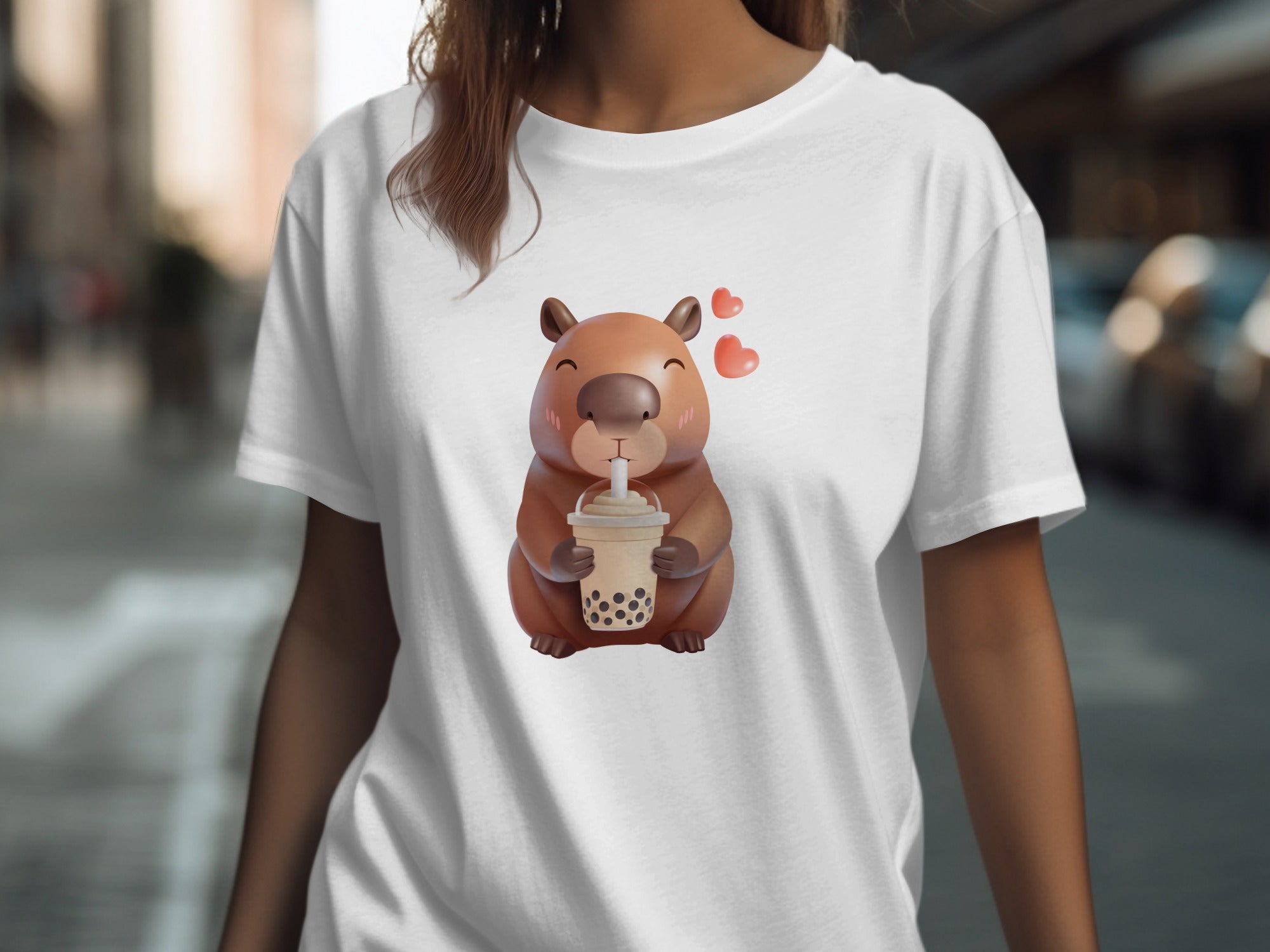 White t-shirt with a cute capybara holding a bubble tea and three hearts.