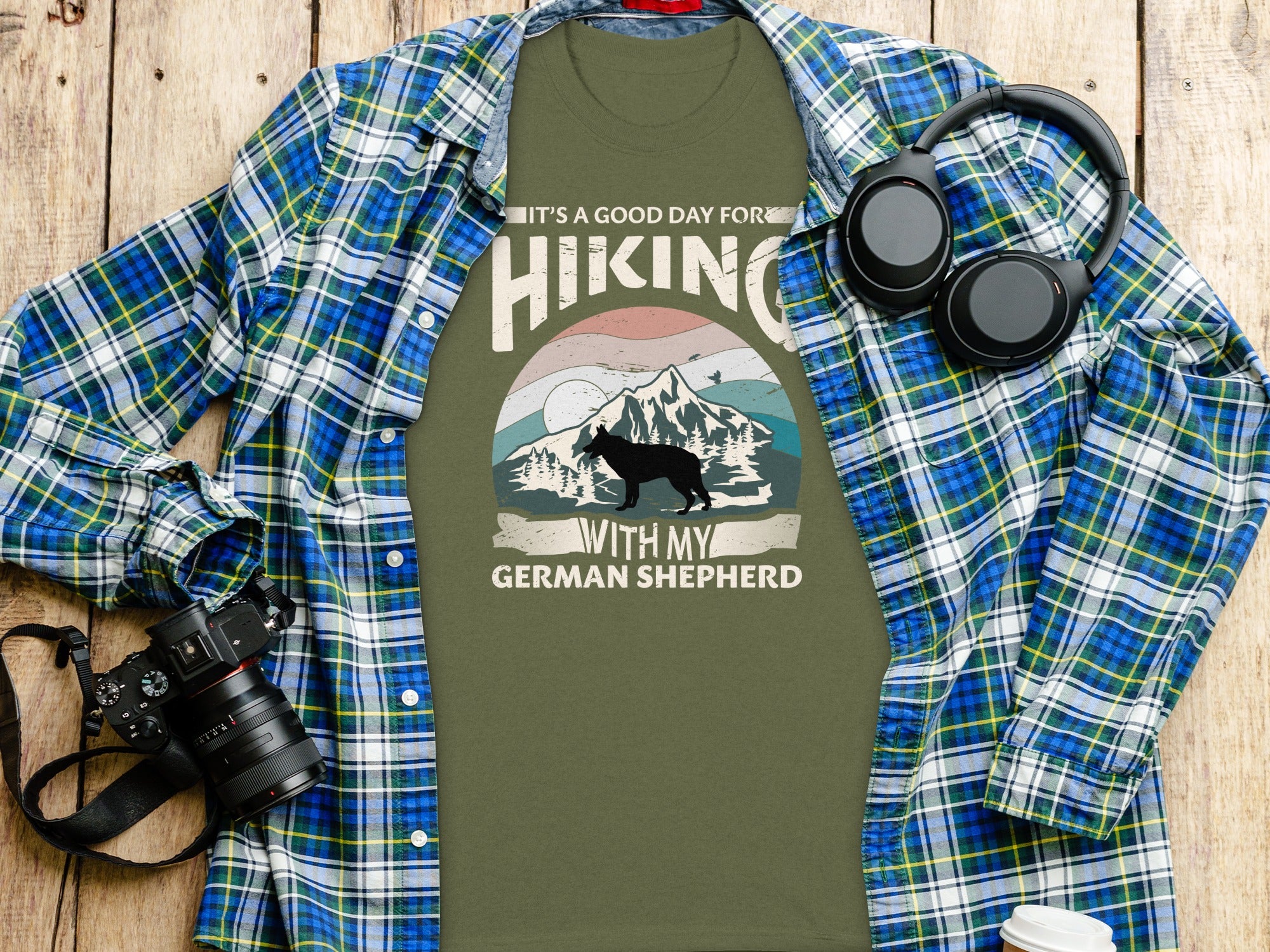Green t-shirt with "It's a good day for hiking with my German Shepherd" graphic.