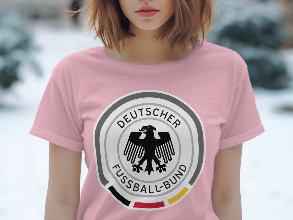 Pink t-shirt with German Football Association crest and text.
