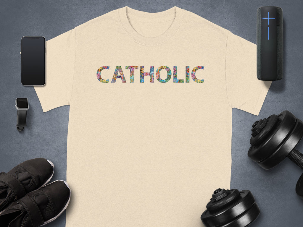Light beige t-shirt with "CATHOLIC" in colorful patterned letters.