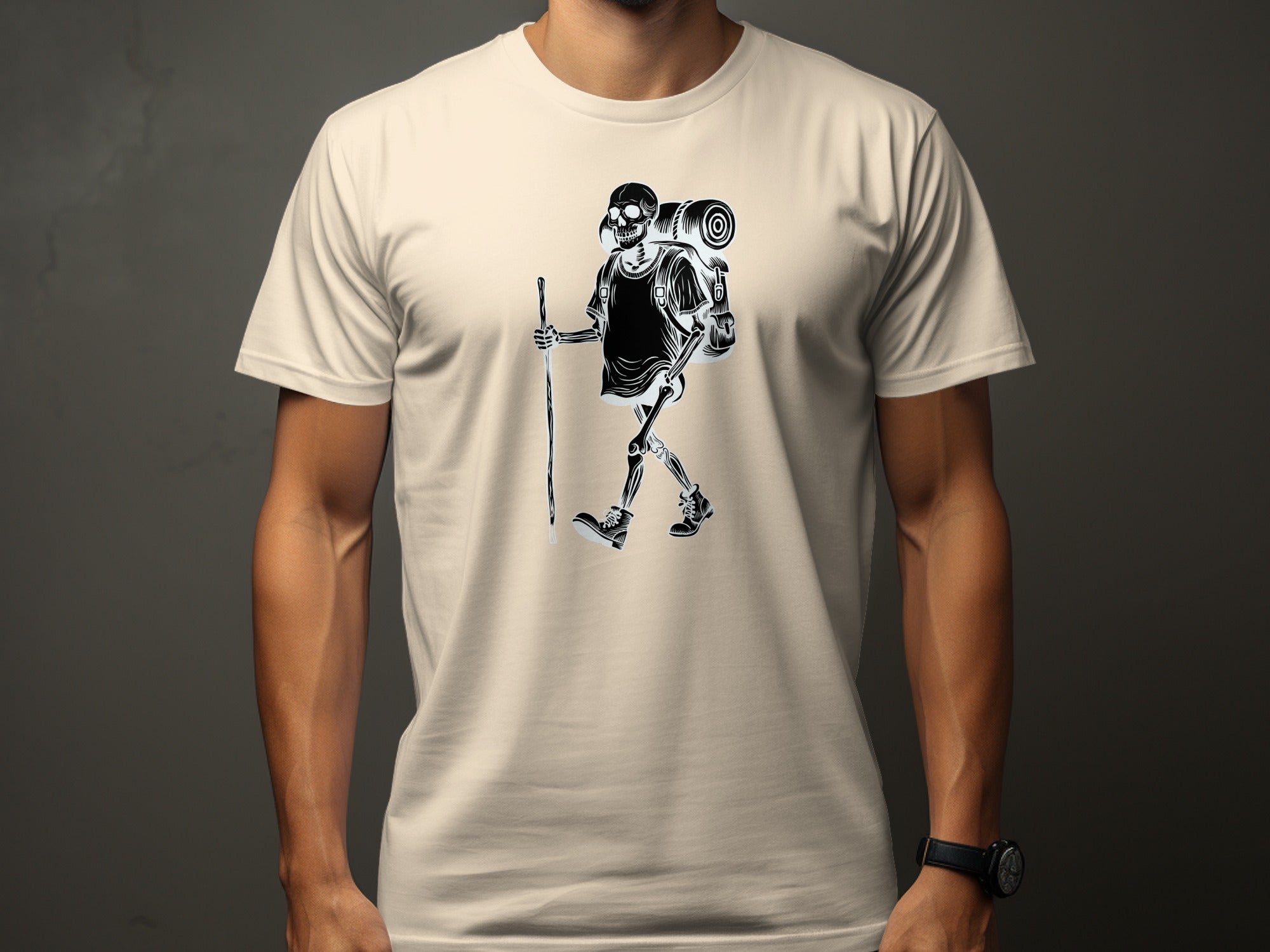 Black and white skeleton hiker graphic on a cream t-shirt.