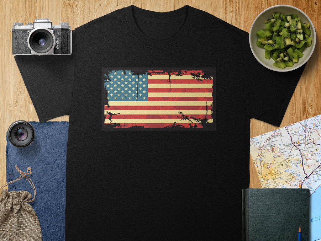Black t-shirt with distressed American flag graphic and camera accessories.