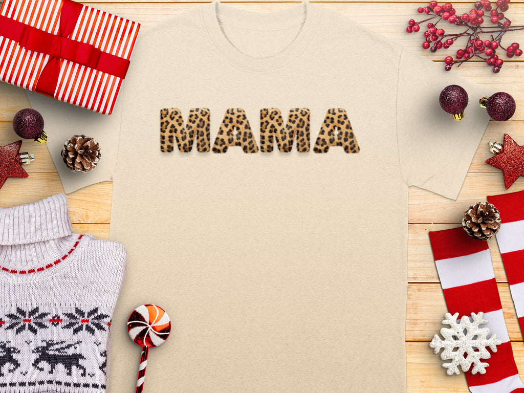 Cream t-shirt with "MAMA" in leopard print letters, surrounded by Christmas decorations.