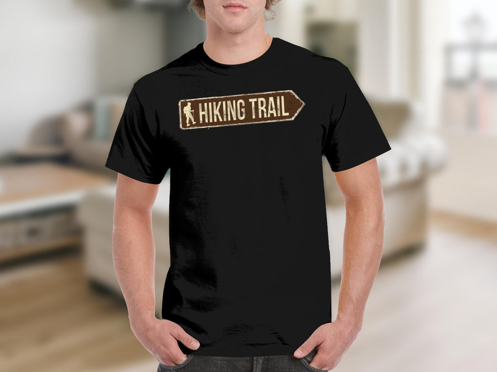 Black t-shirt with a rustic brown hiking trail sign featuring a hiker graphic.
