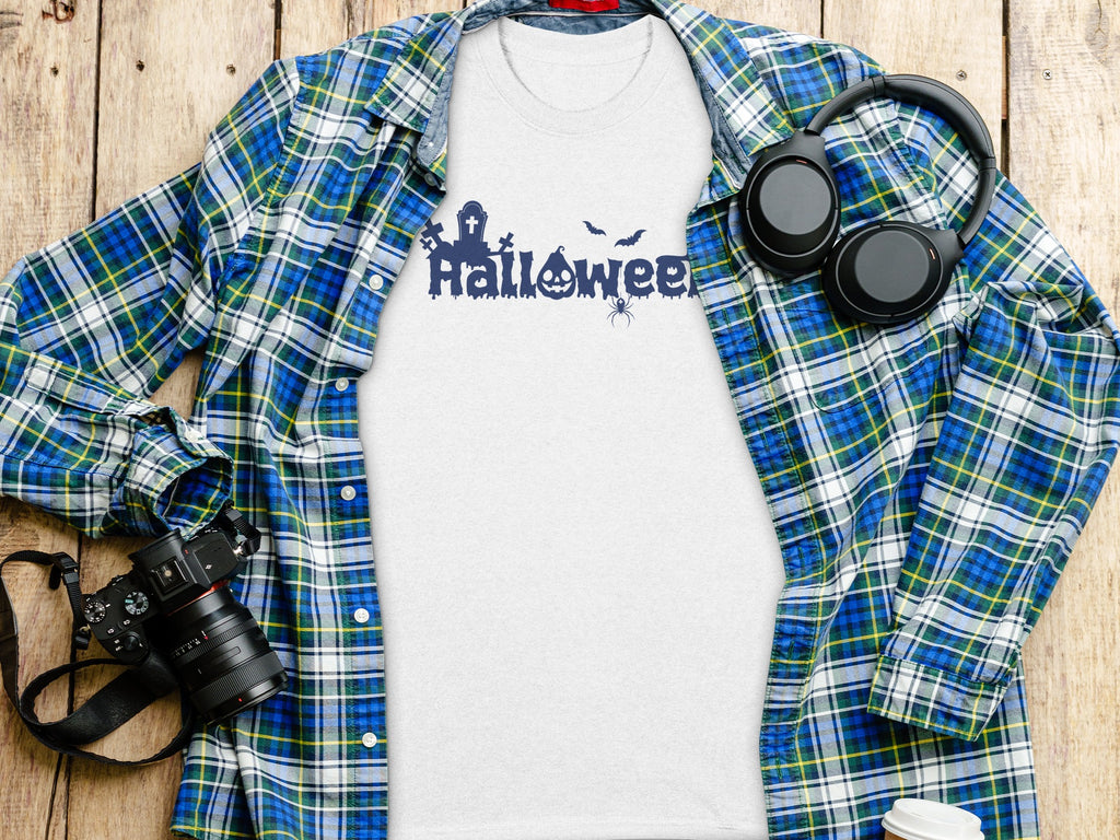 White t-shirt with blue Halloween graphic, plaid shirt, headphones, and camera.