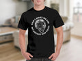 Black t-shirt with a white graphic of a hockey helmet and text.