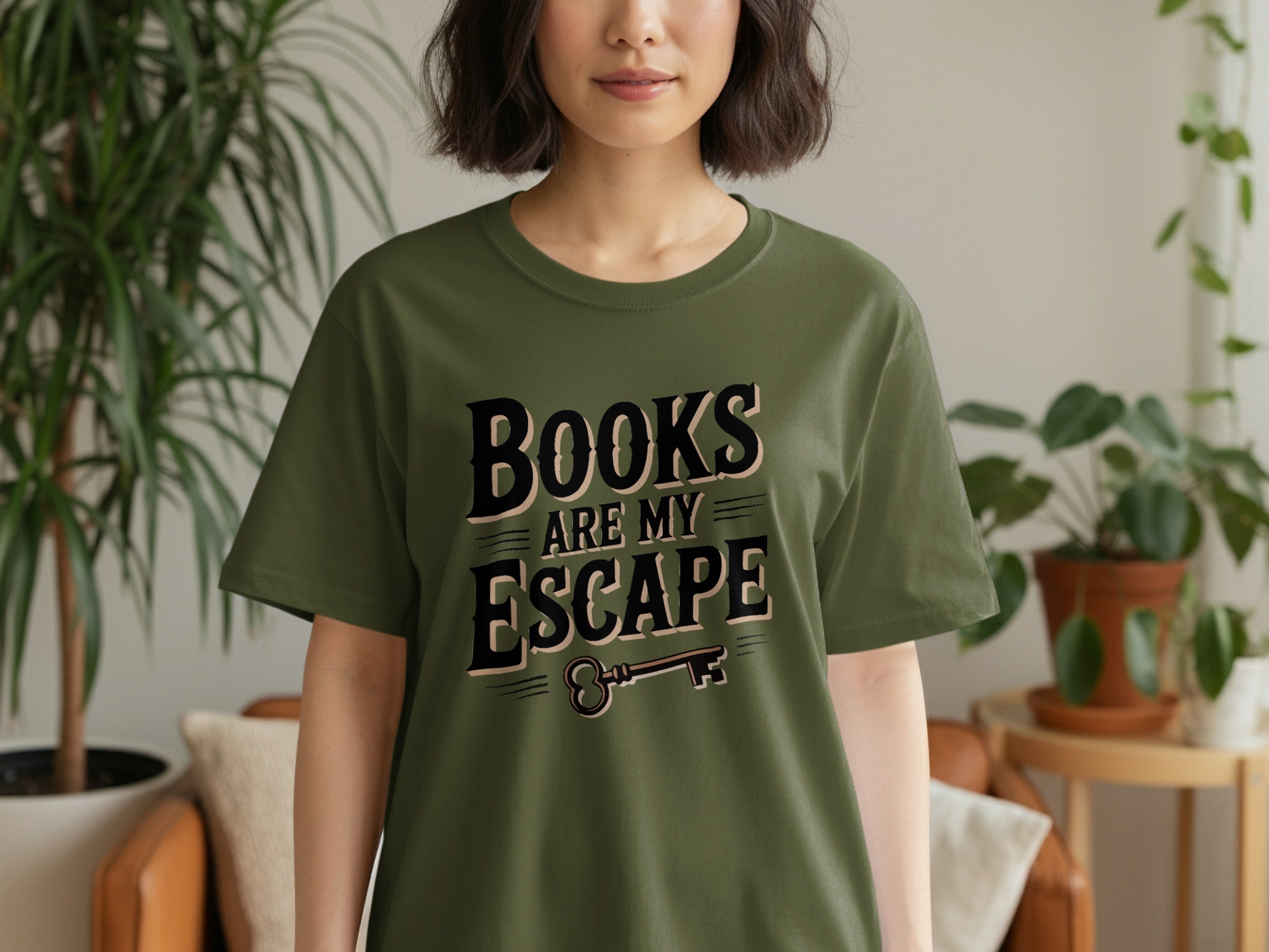 Olive green t-shirt with text "BOOKS ARE MY ESCAPE" and a key.