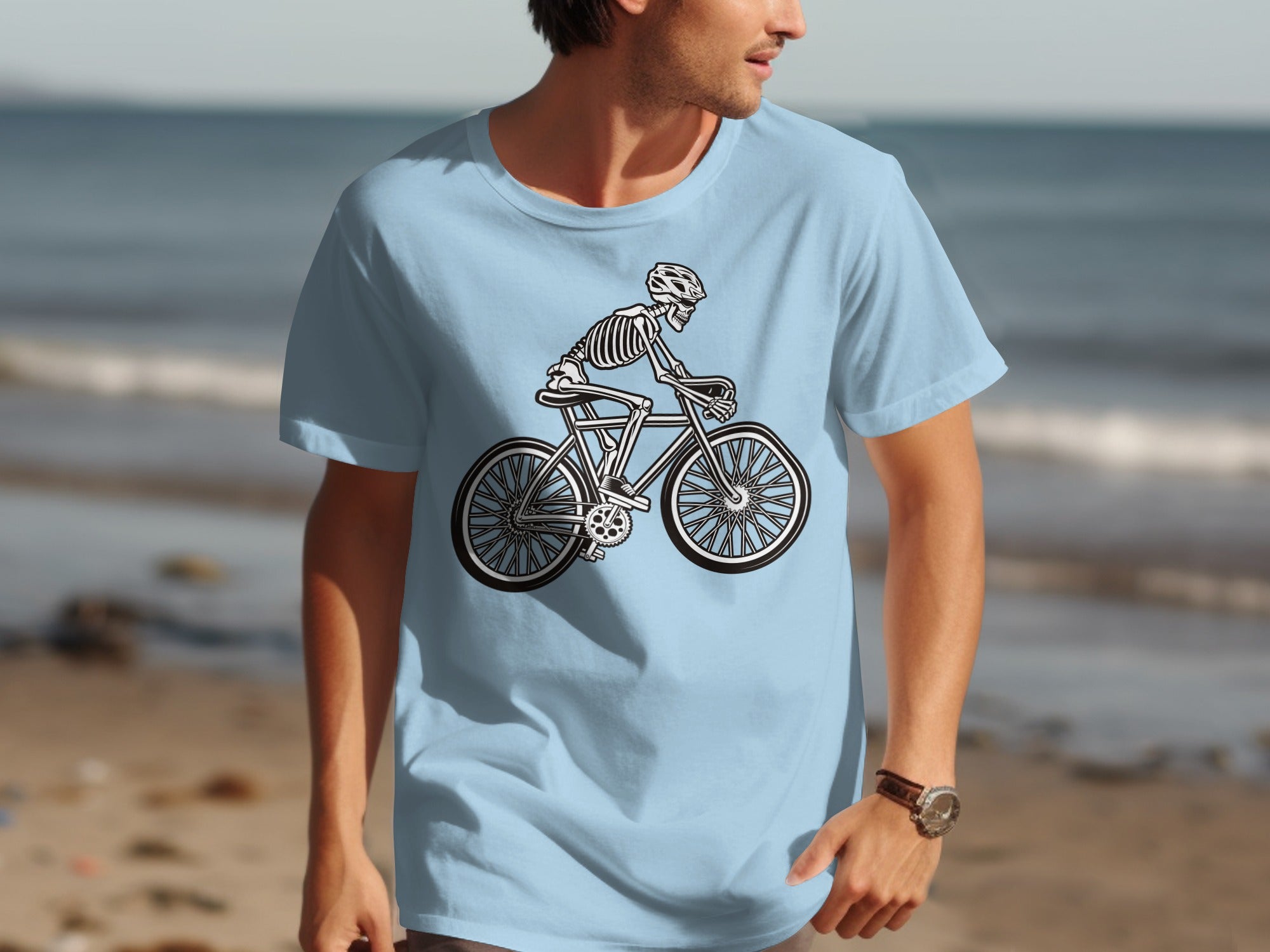 Light blue t-shirt with a skeleton riding a bicycle graphic.