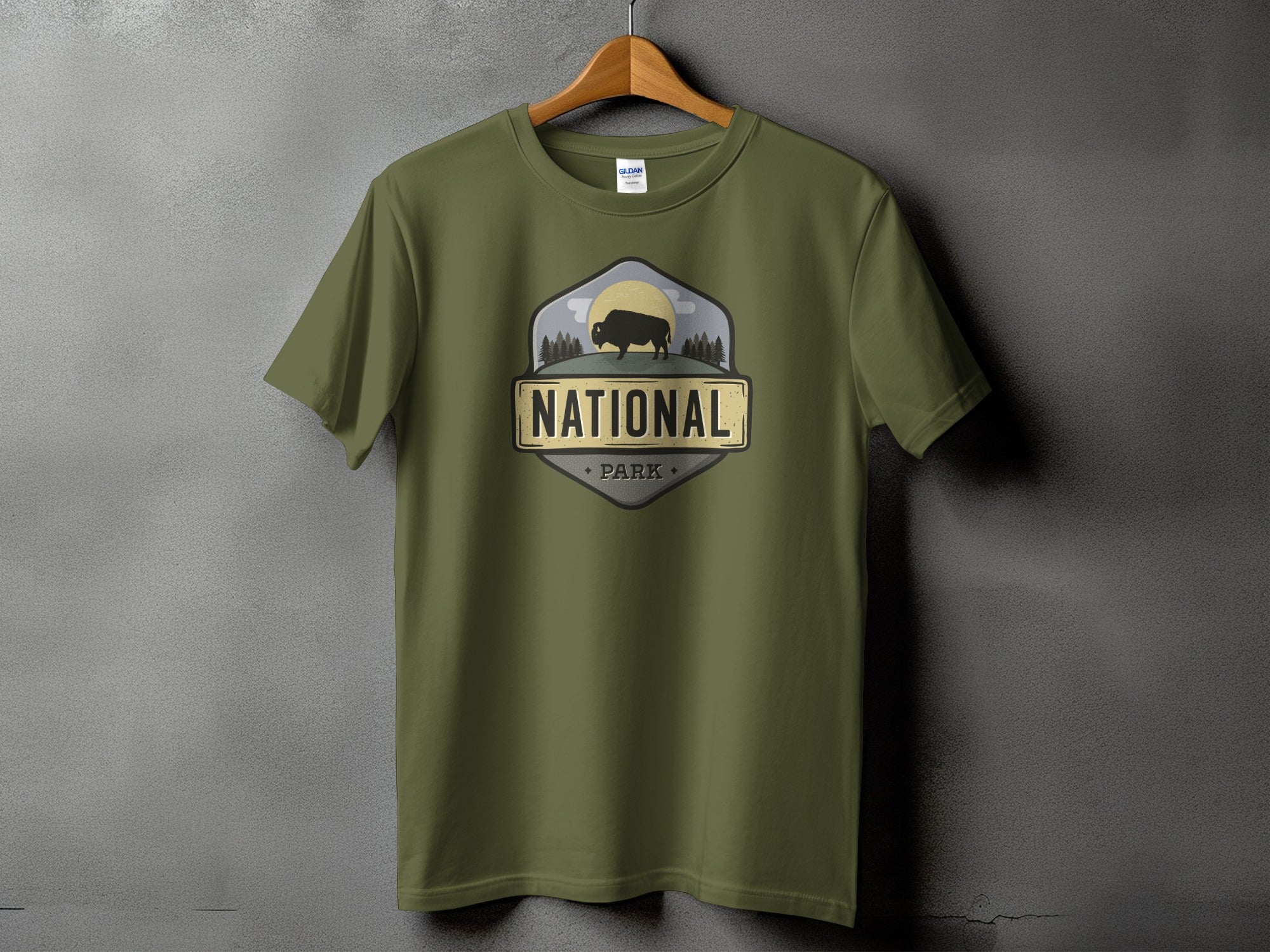 Olive green t-shirt with National Park bison and forest graphic.