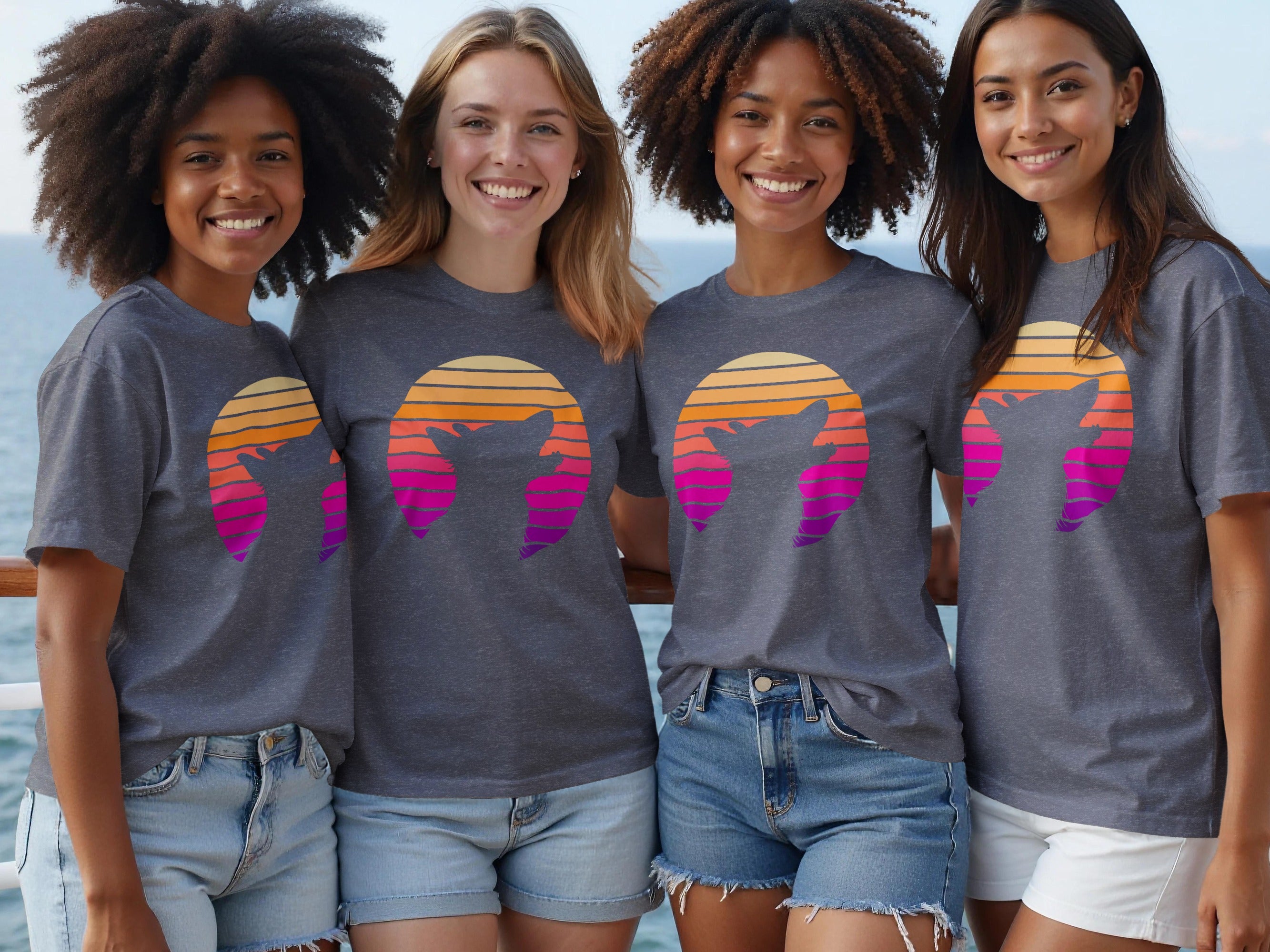Four friends wear grey t-shirts with a sunset graphic featuring a cat silhouette.